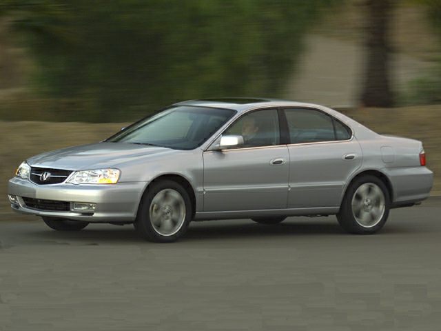 Silver sedan side profile with smooth body lines and classic design.