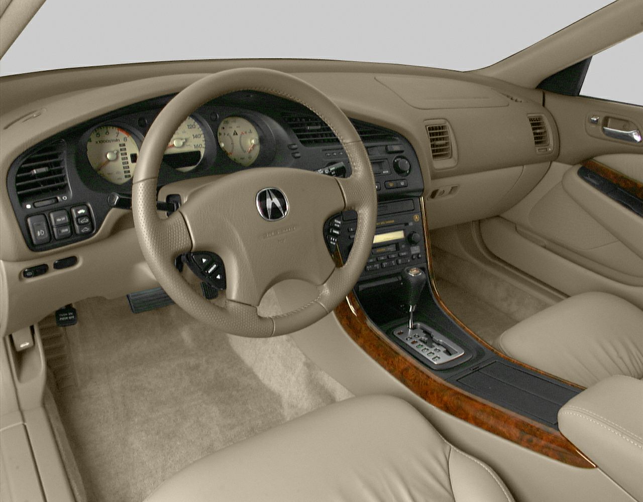 Beige leather interior with wood trim console and analog dashboard