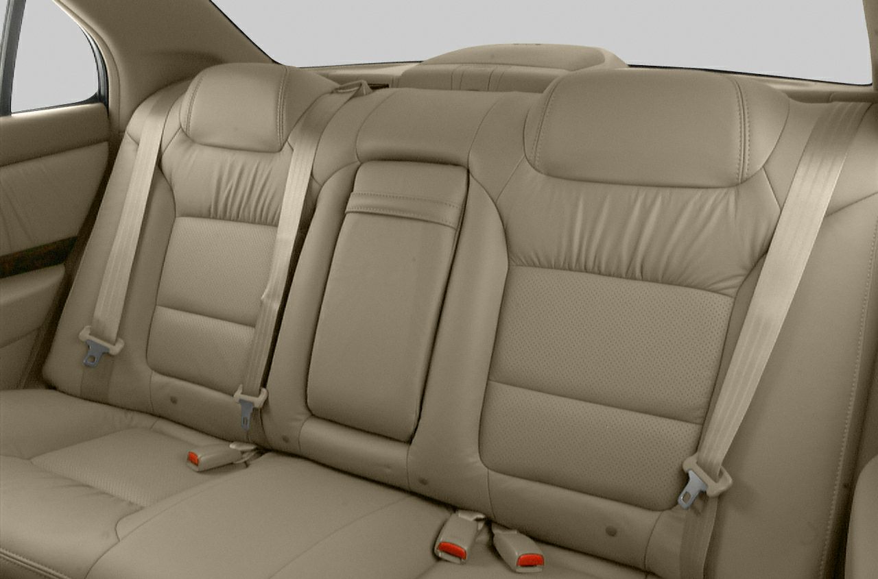 Beige leather rear seats with integrated headrests and seatbelts