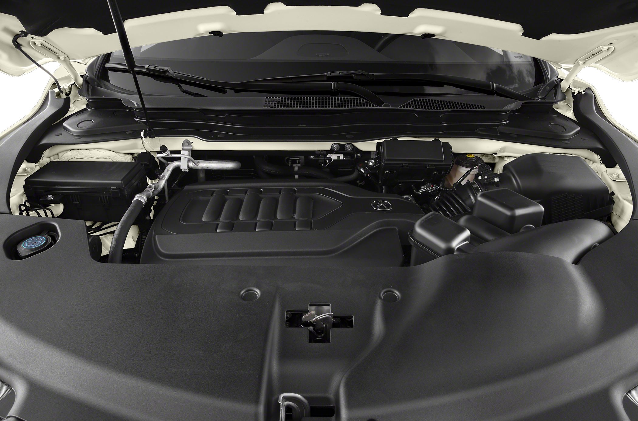 Engine compartment with modern engine cover and surrounding components.