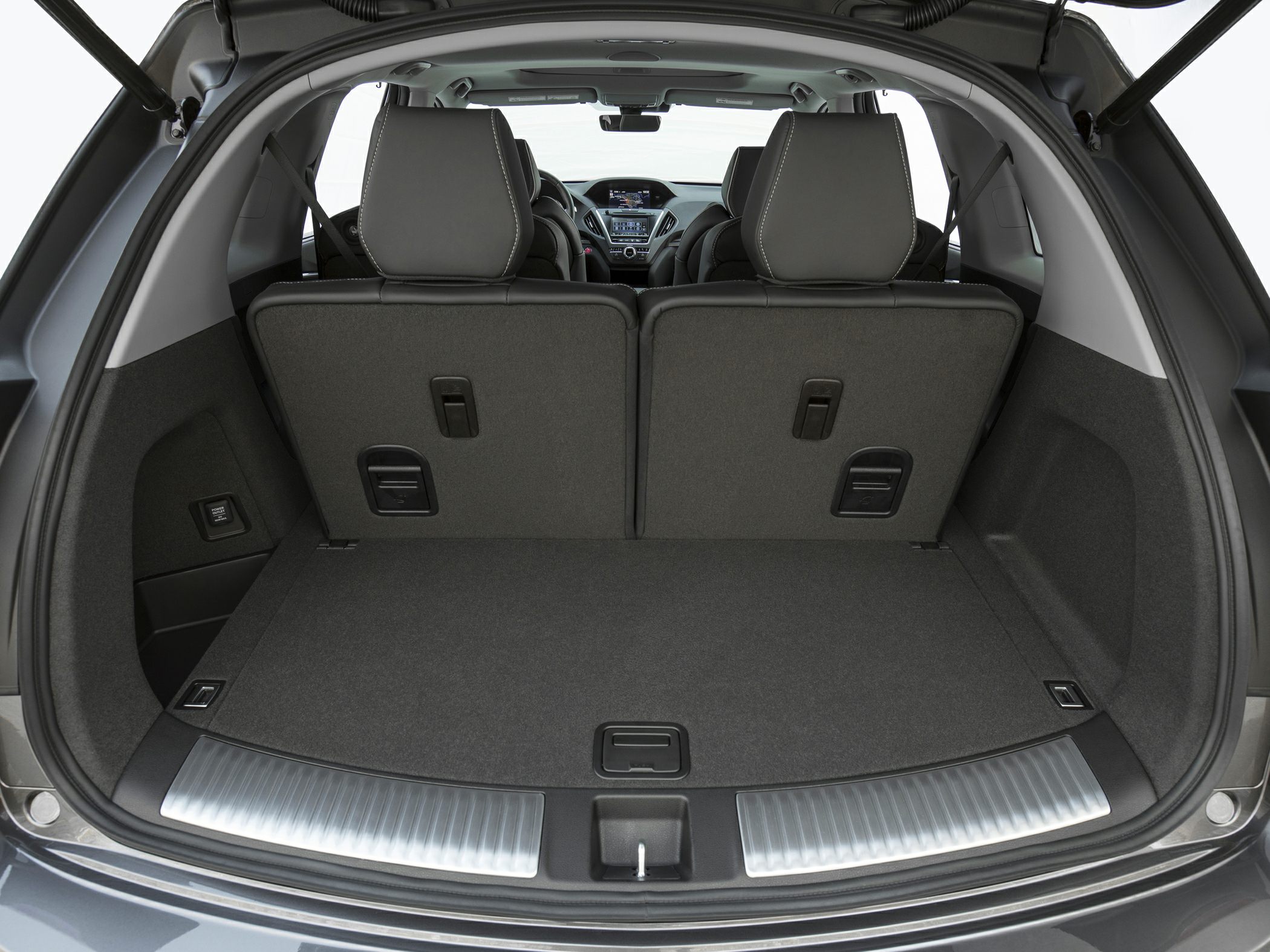 Spacious rear cargo area with foldable seats and premium interior.