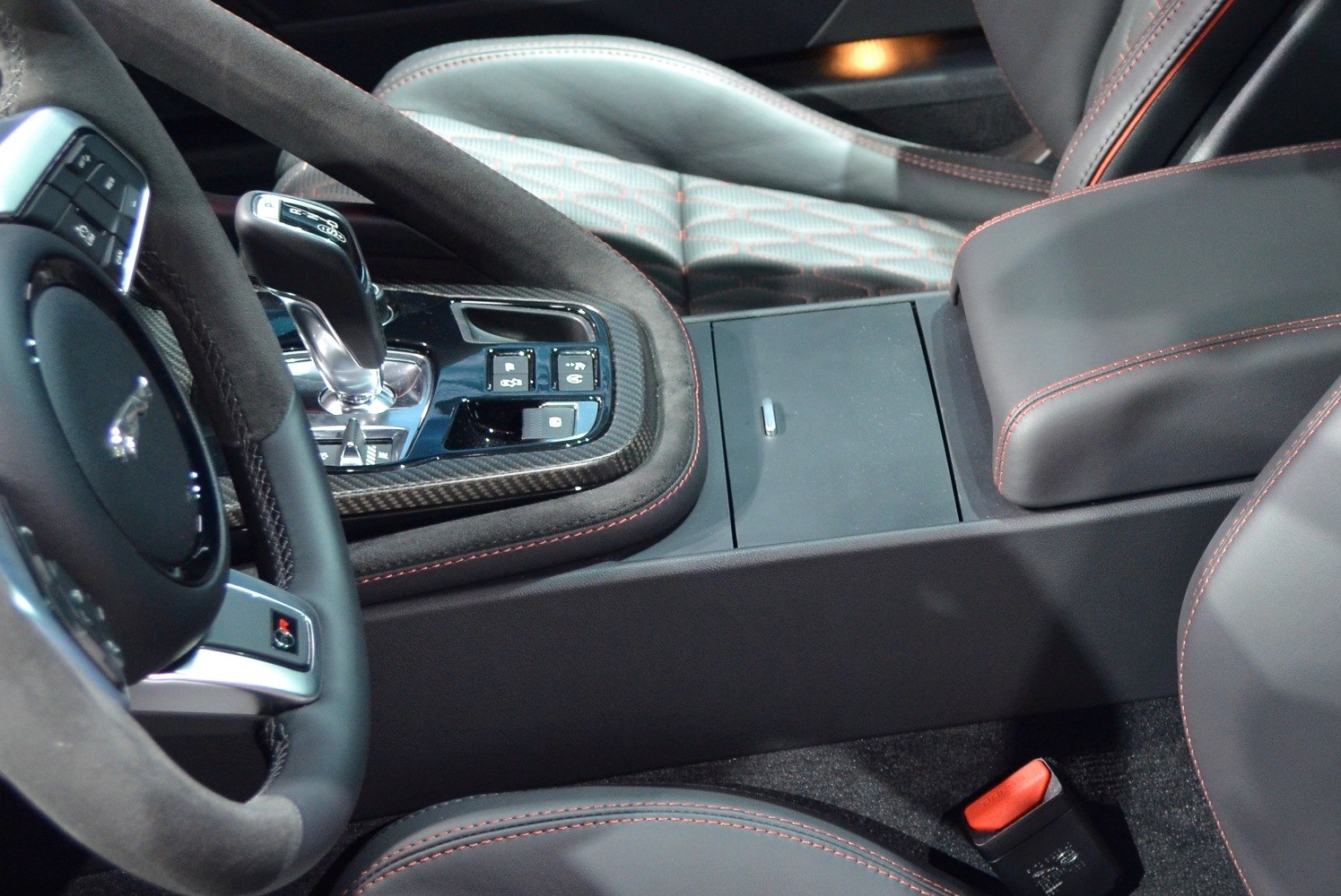 Center console with gear shift and steering wheel close-up