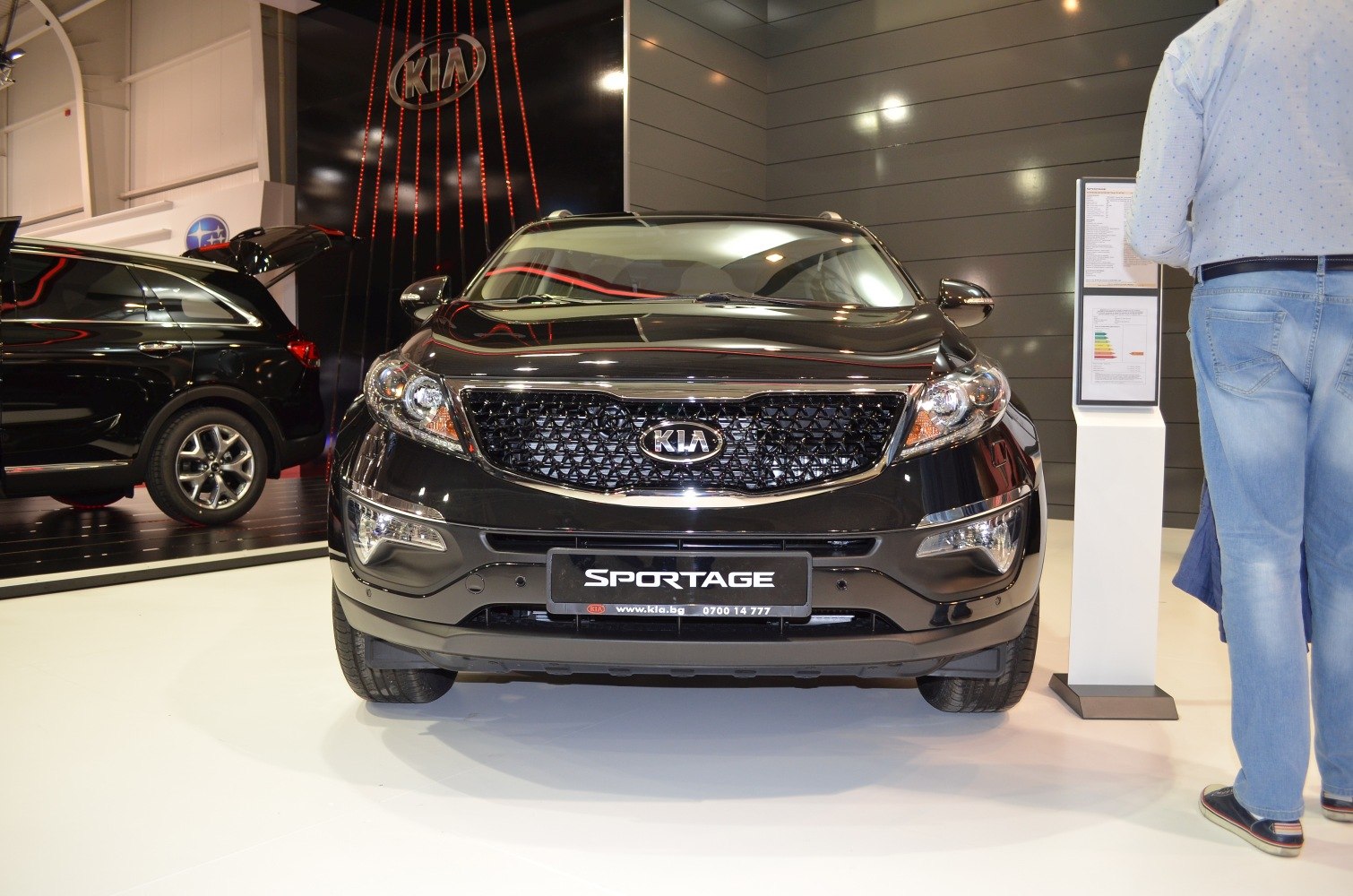 Front view of SUV showing grille, headlights, and logo
