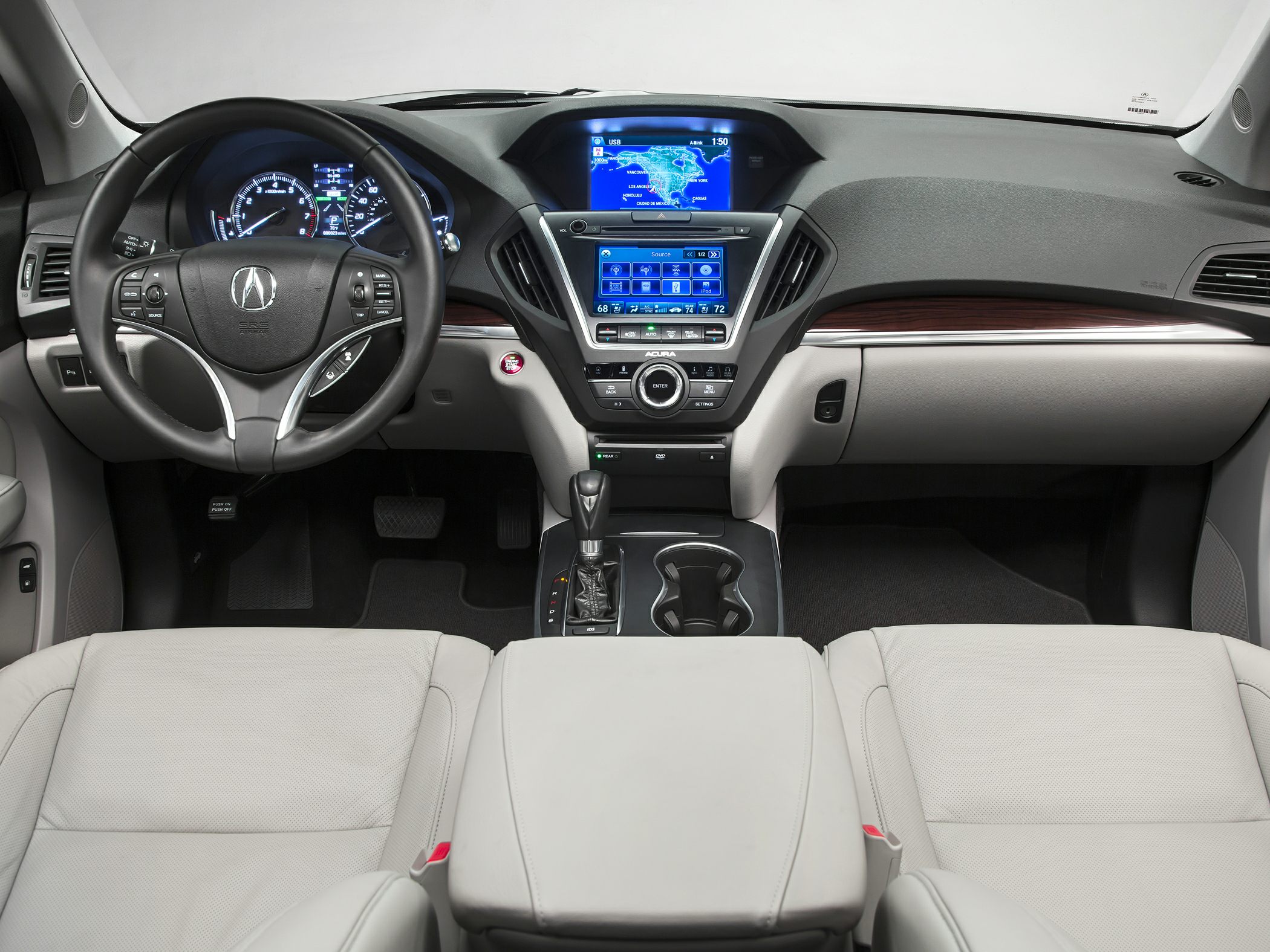 Dual-screen dashboard and leather seats in luxury SUV interior