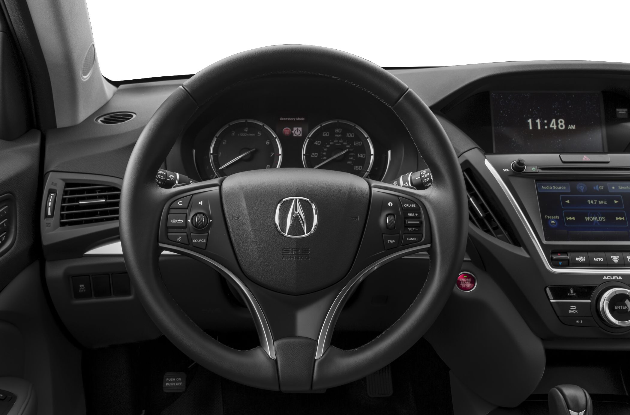 Steering wheel with controls and dashboard cluster focusing on infotainment system