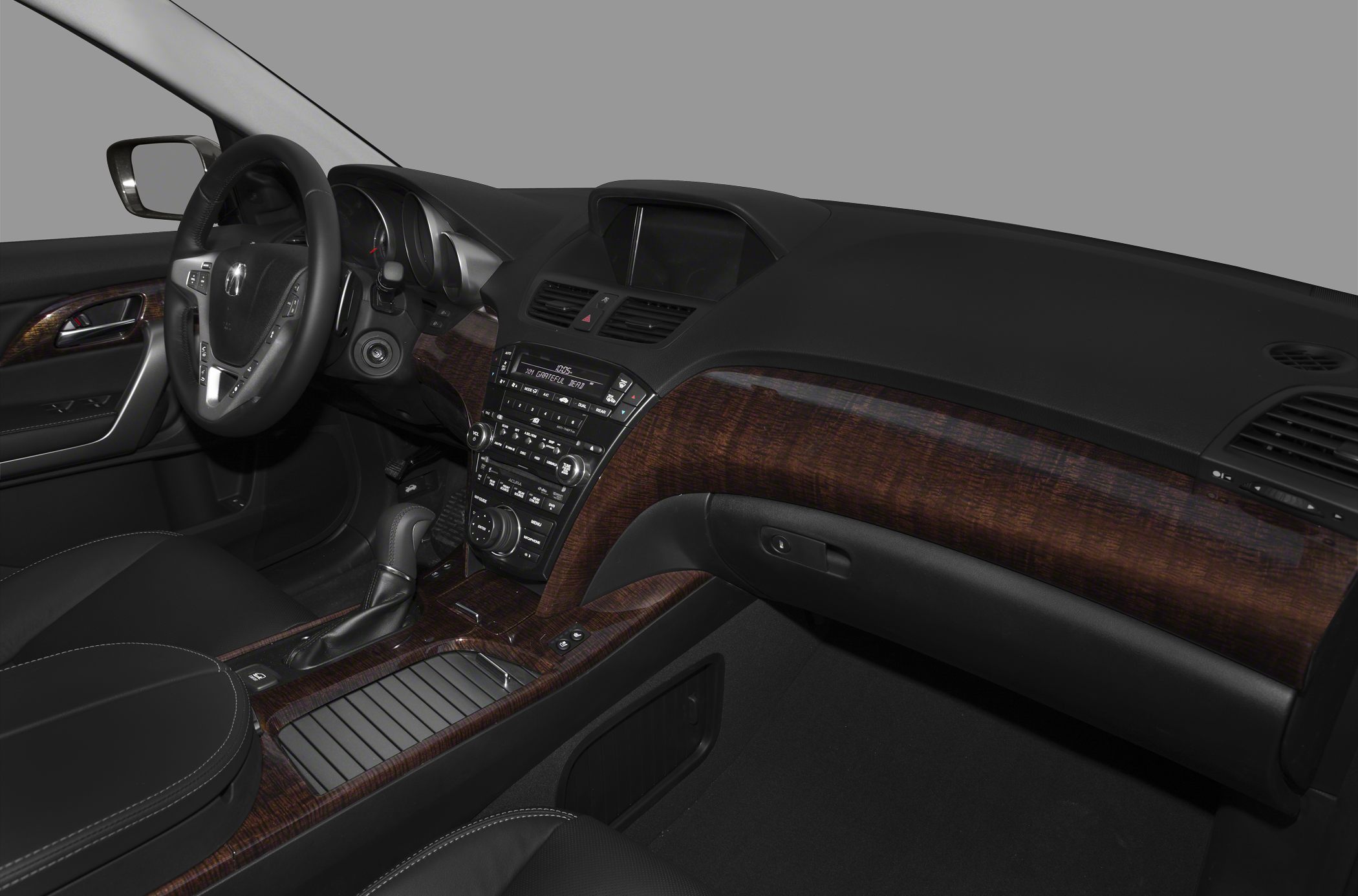 Wood-trimmed dashboard and center console with controls