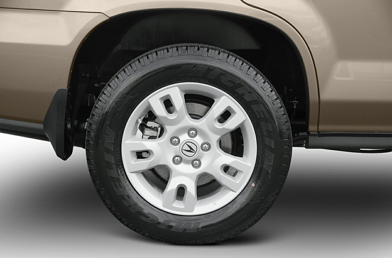 Close-up of alloy wheel and Michelin tire on an SUV.