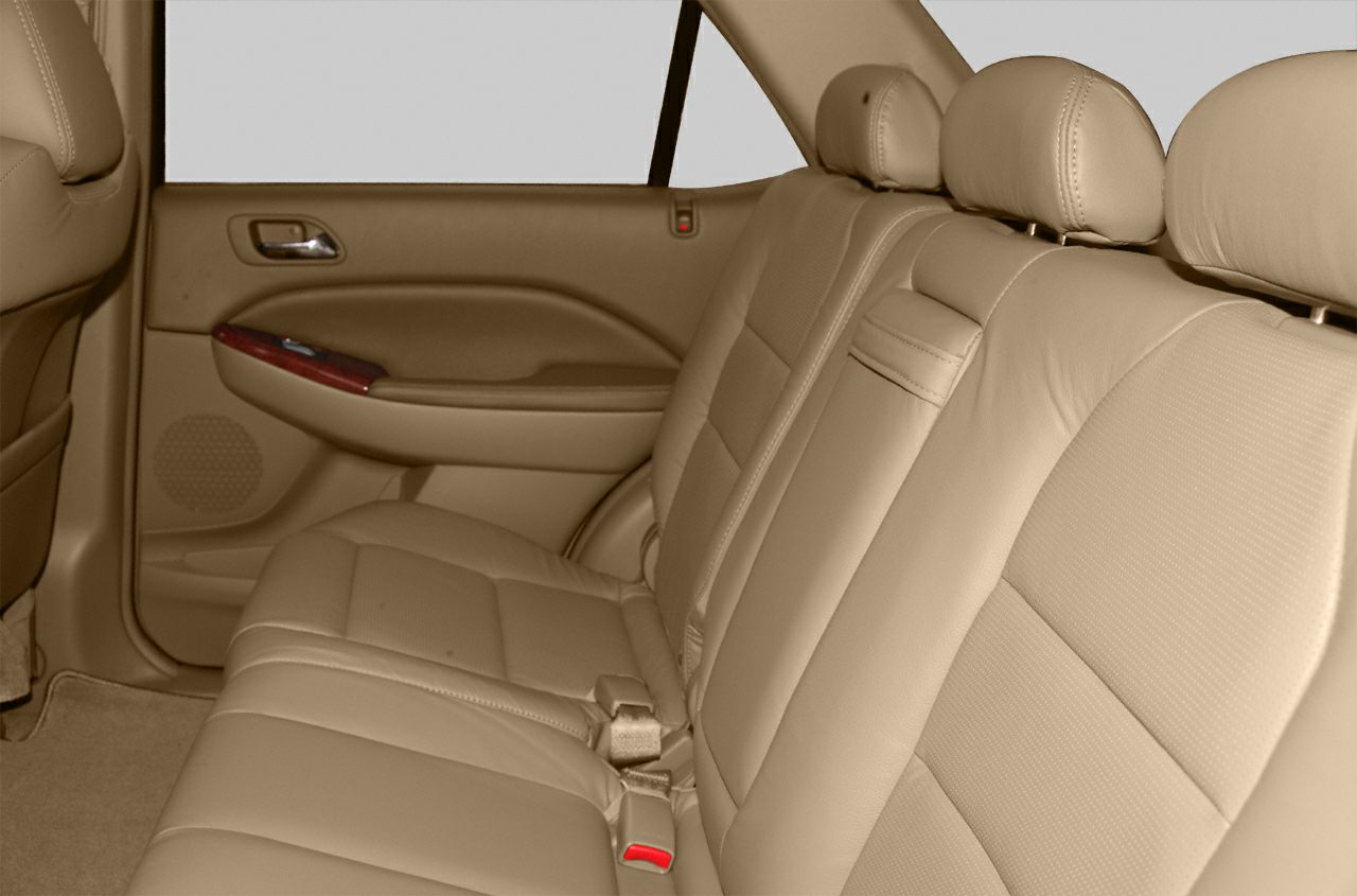 Beige leather rear seat with headrests and door panel details