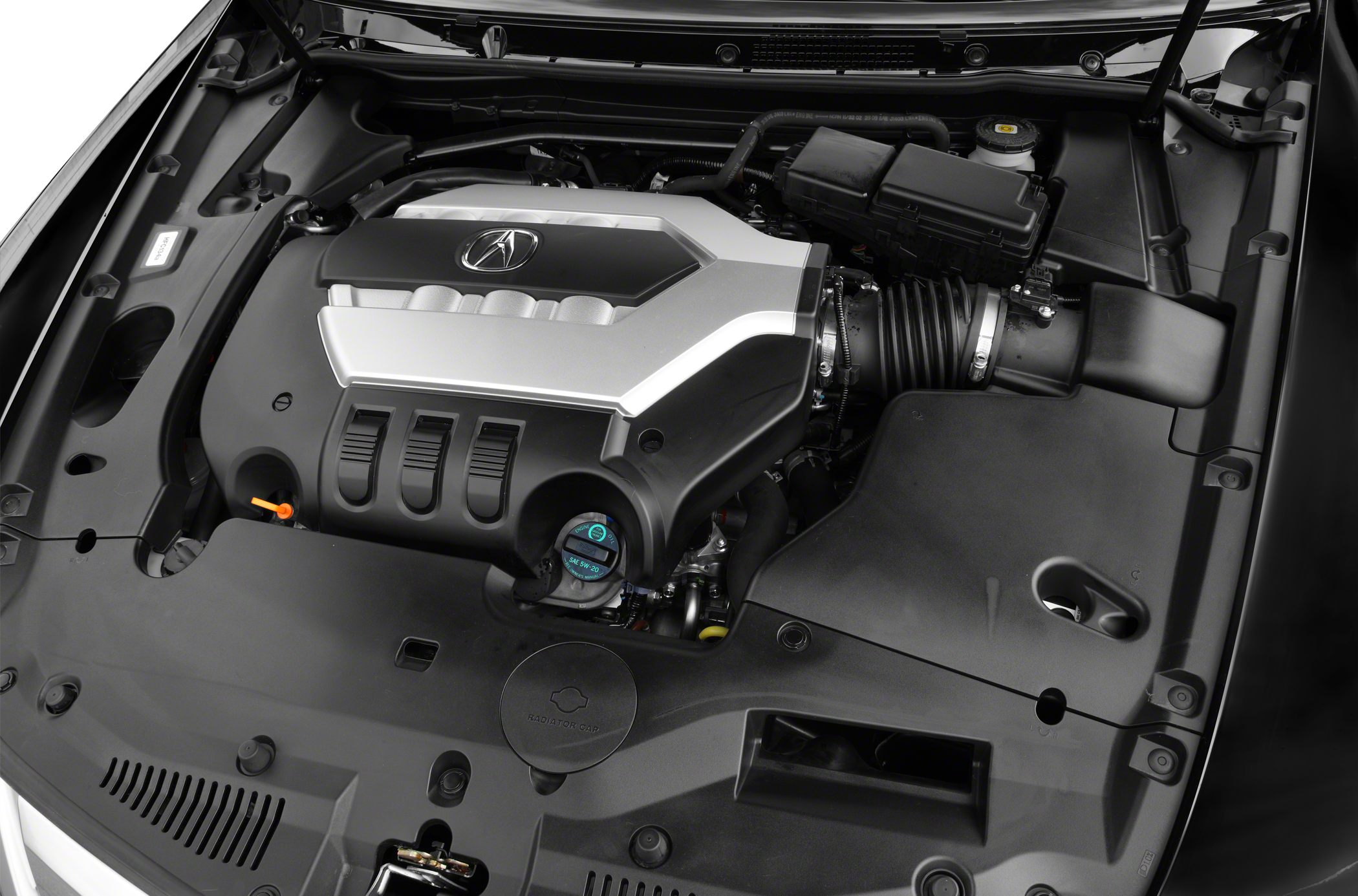 Engine bay showing V6 engine cover and air intake system under the hood