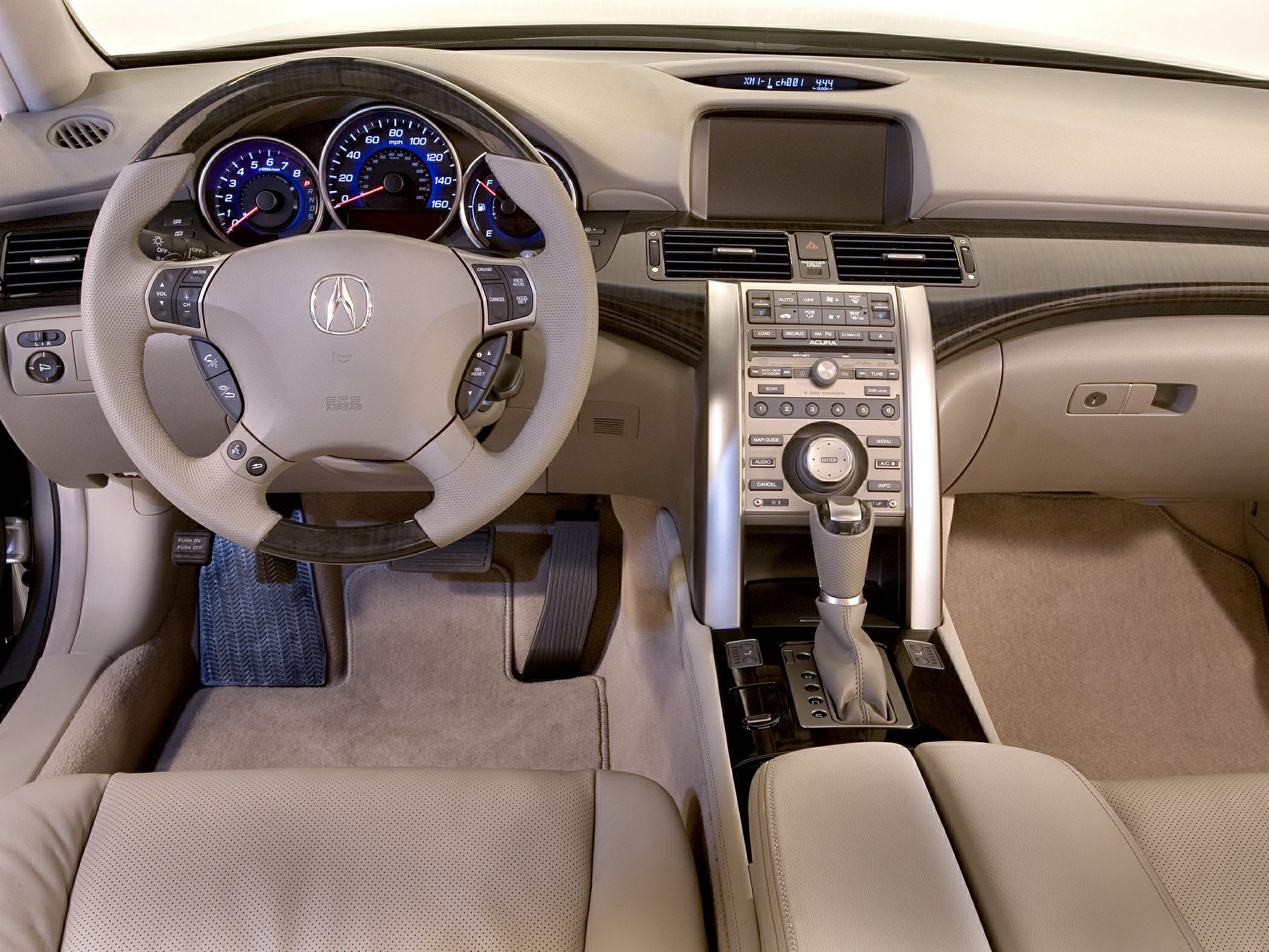 Dashboard, steering wheel, and center console with controls and gauges