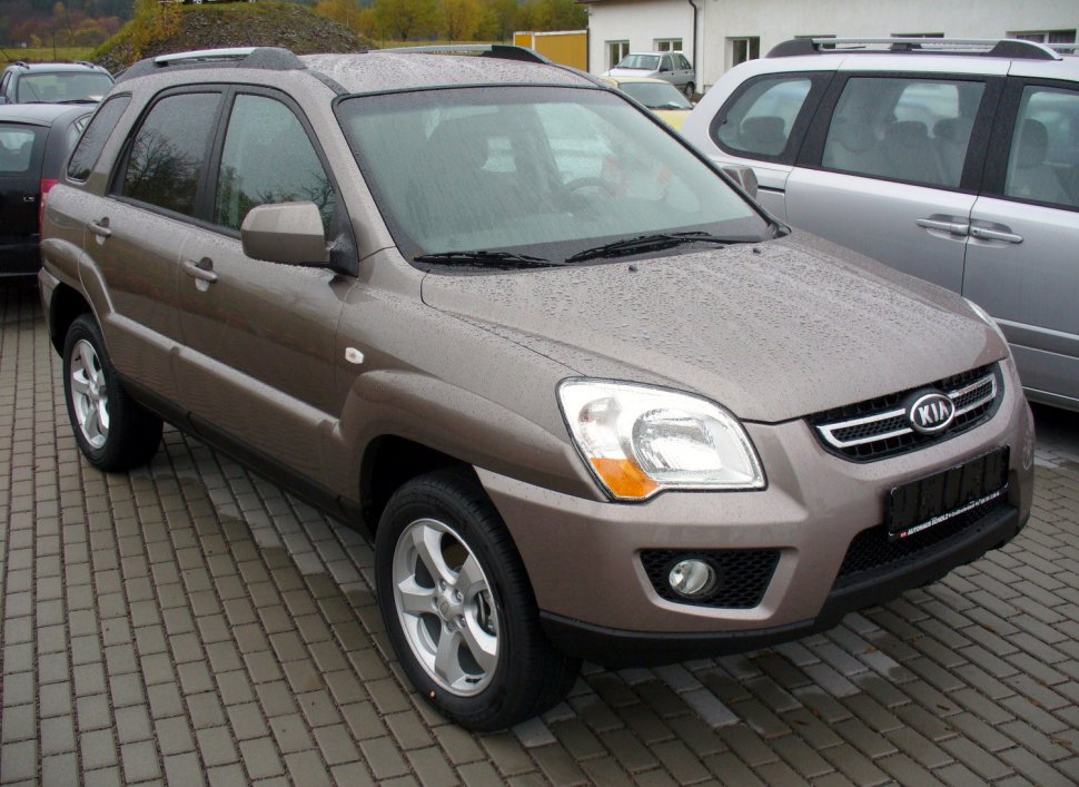 Front side view of a compact SUV with alloy wheels.