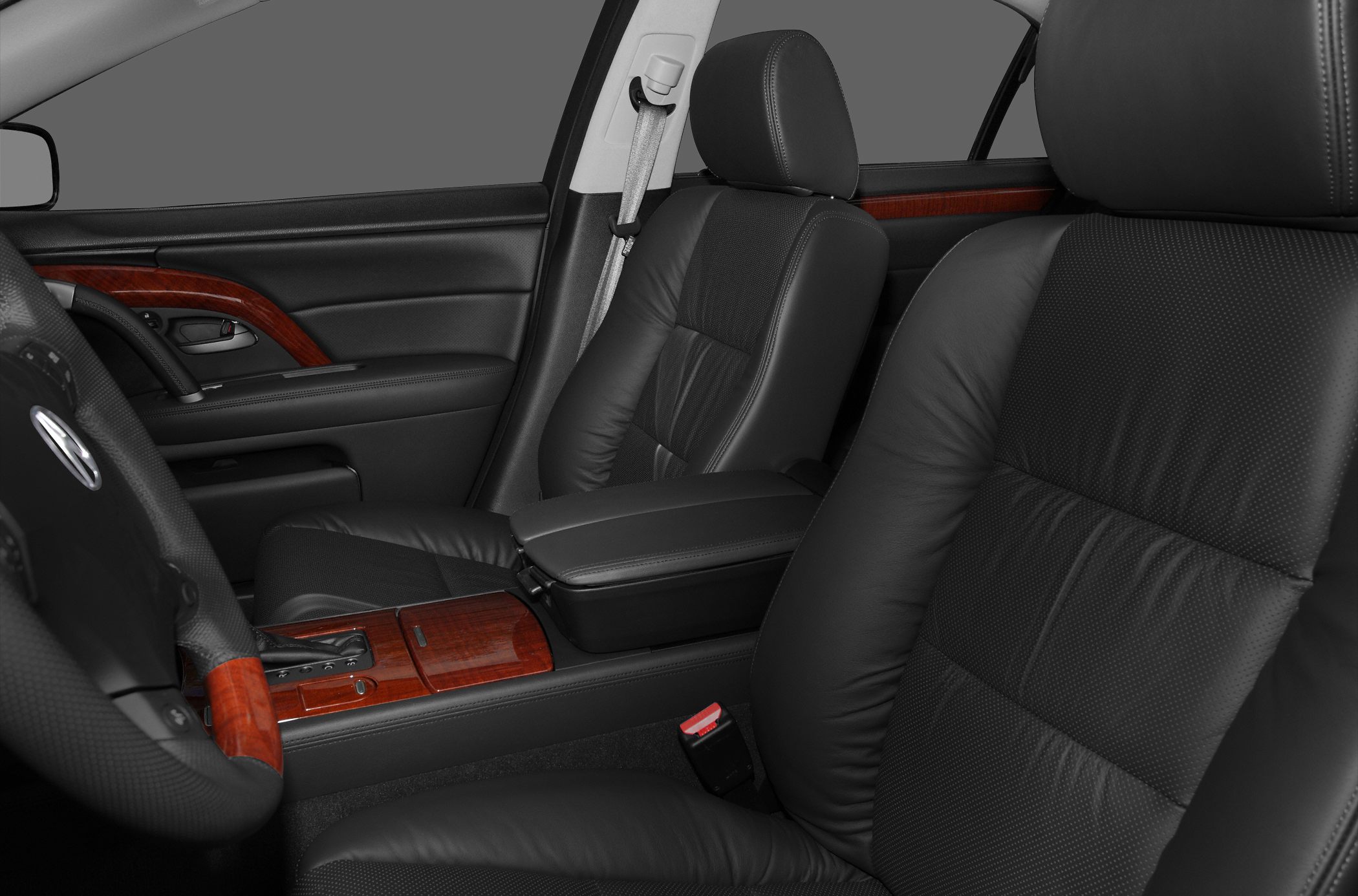 Black leather seats with wood trim and center console.