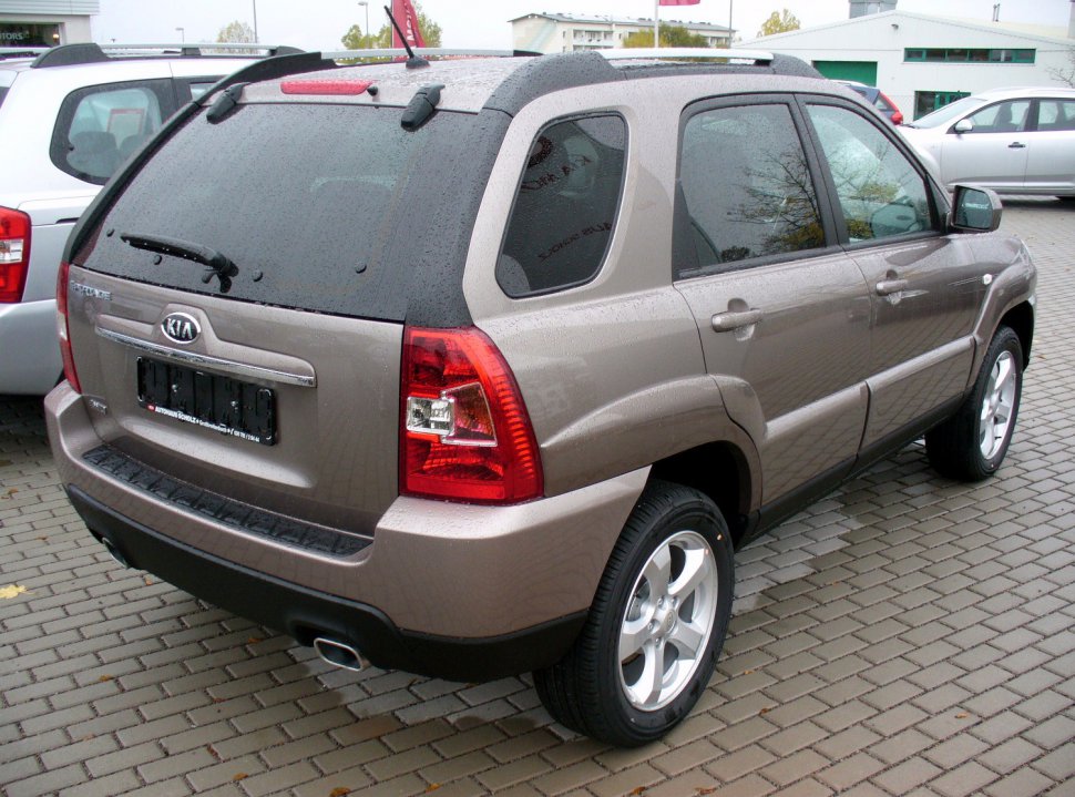 Rear view of SUV with distinctive taillights and rear window in rain.