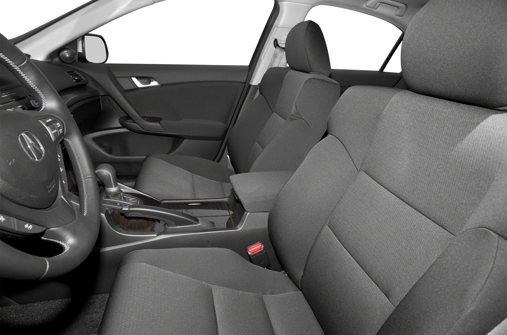 Fabric seats and center console inside a car interior.