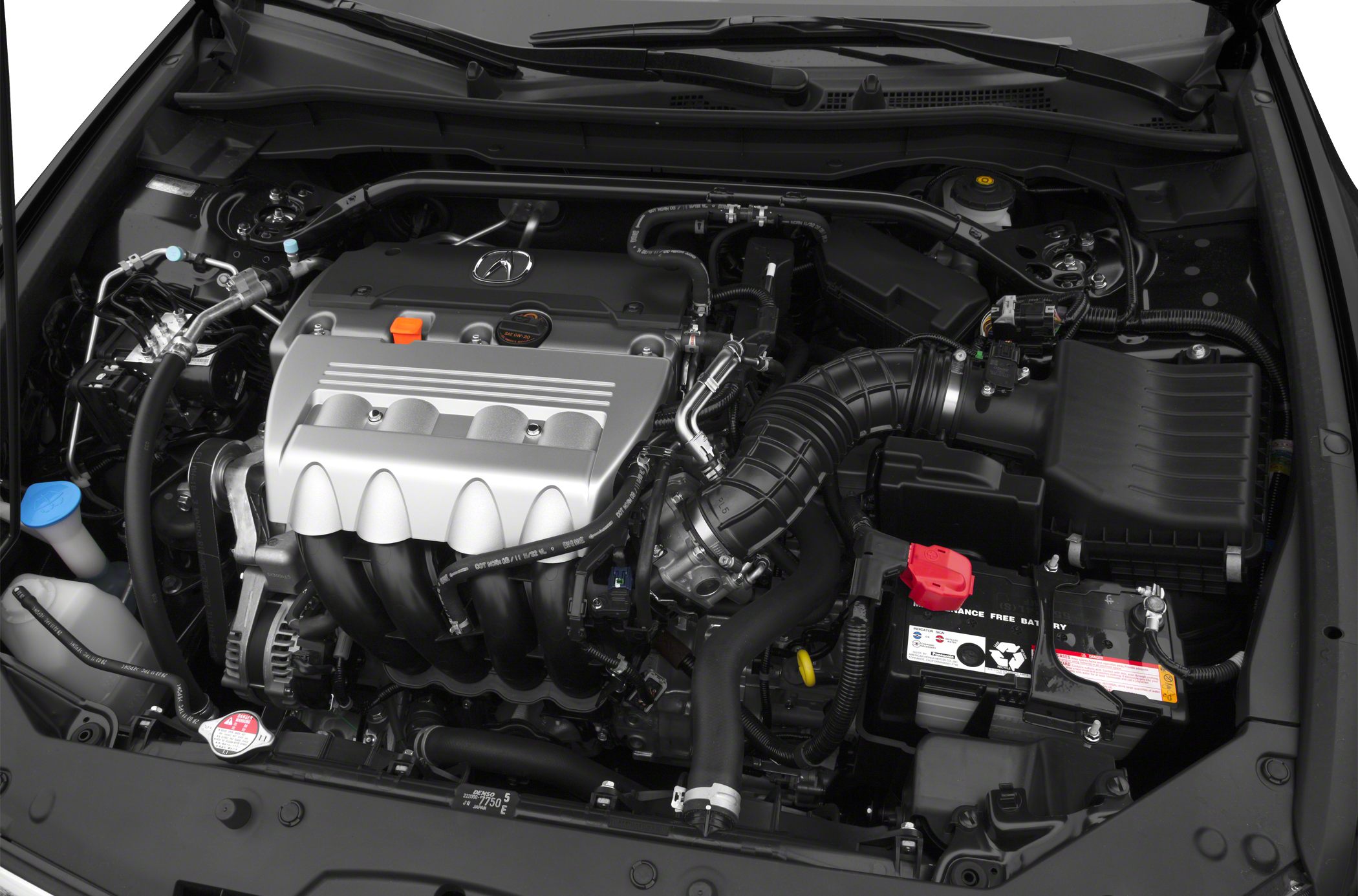 Engine compartment with visible engine, air intake, and battery.
