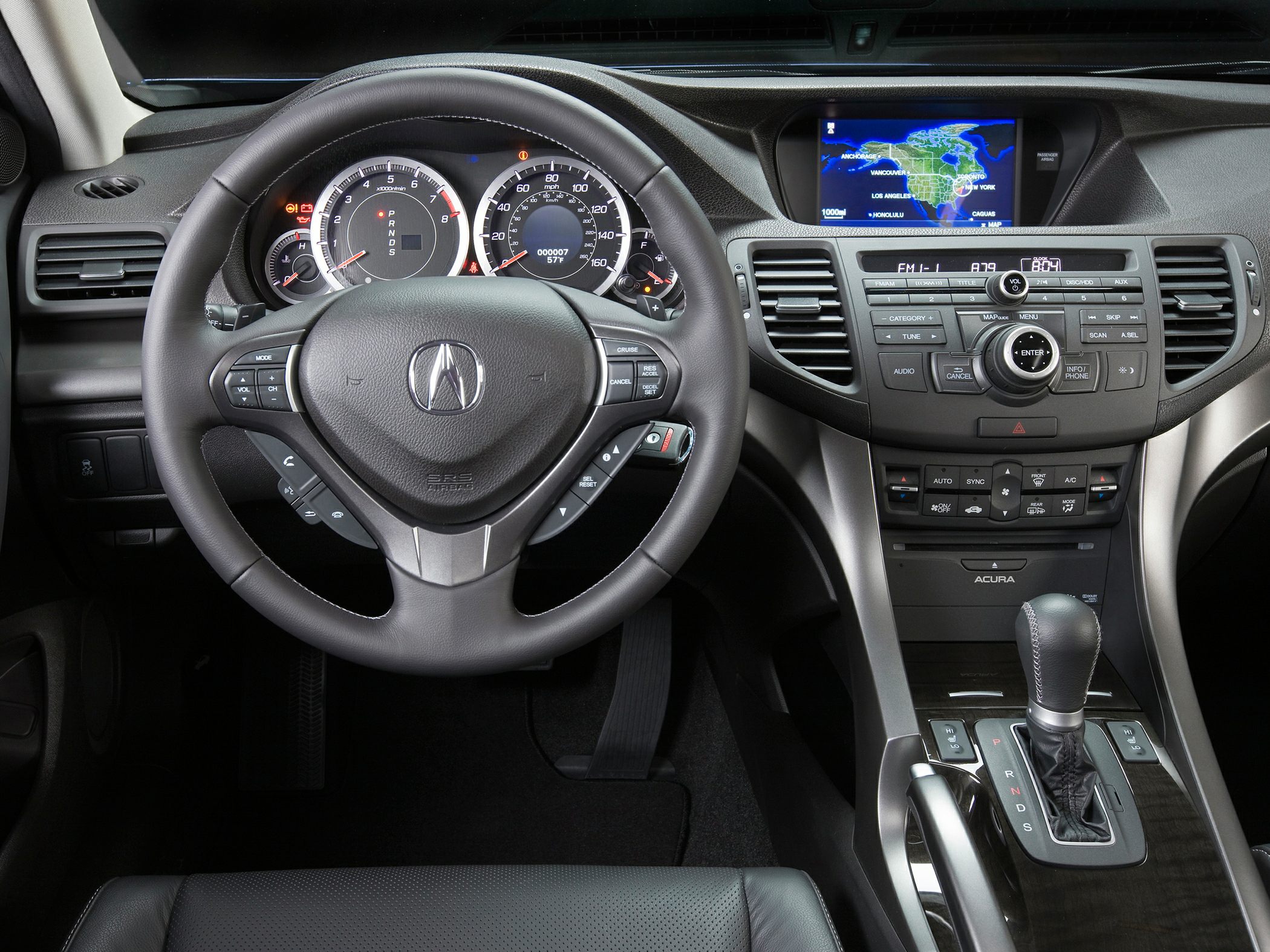 Dashboard, steering wheel, navigation screen, and gear shift layout