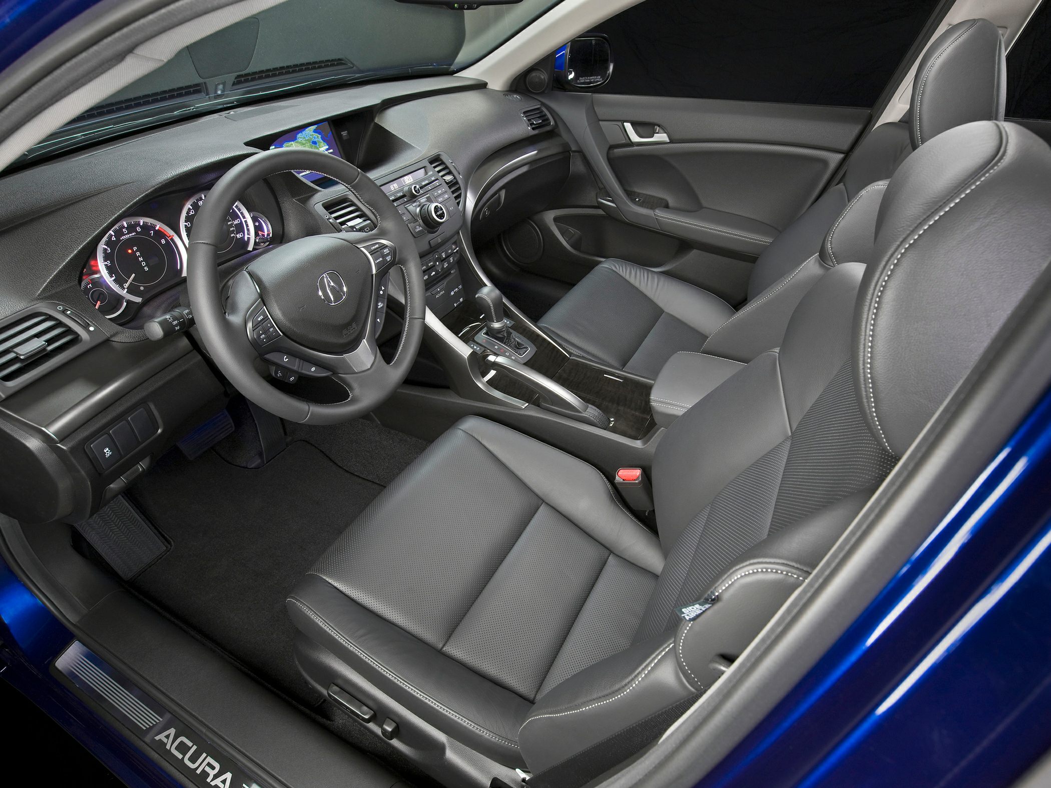 Leather seats and dashboard with steering wheel and center console