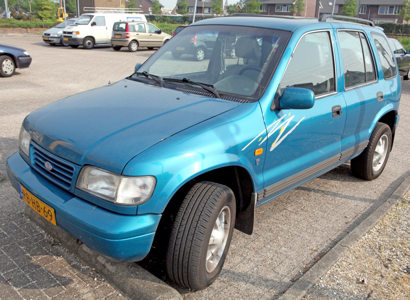 Classic SUV front-side view with angled front wheel and unique side decal