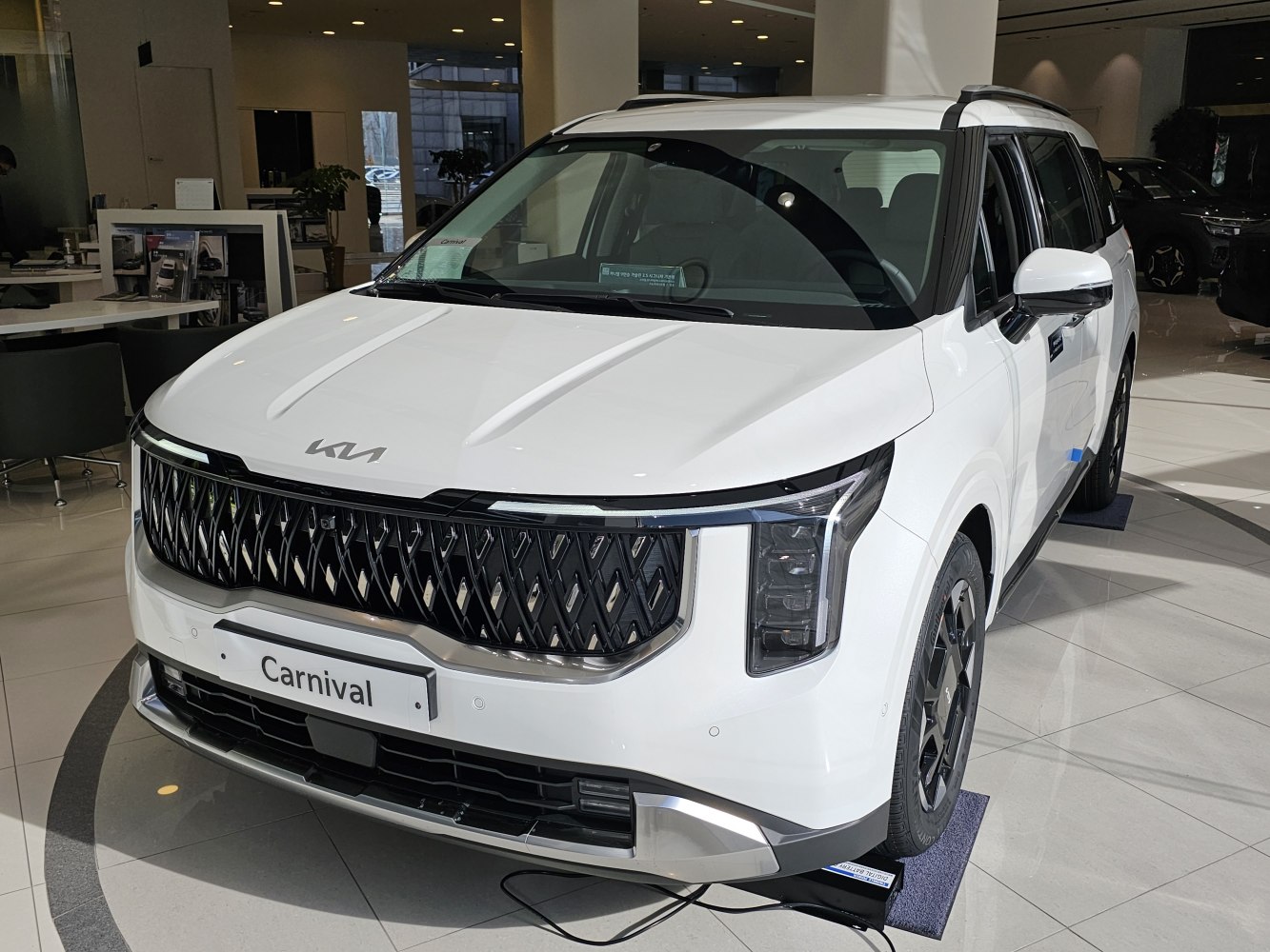 Front grille and vertical LED headlights of modern SUV/minivan