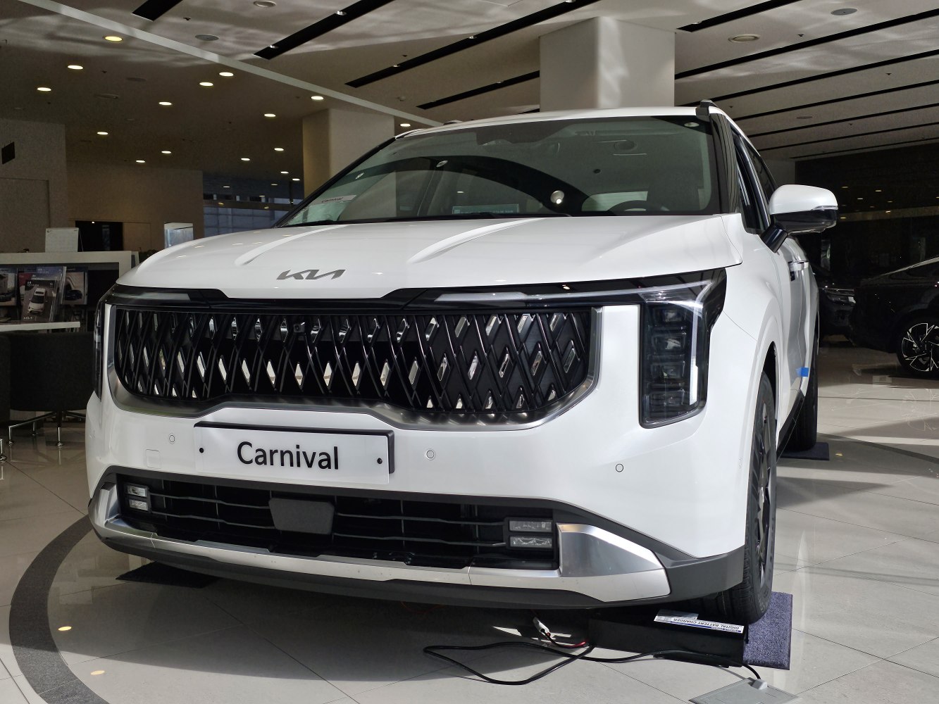 Front grille and vertical LED headlights of a modern minivan