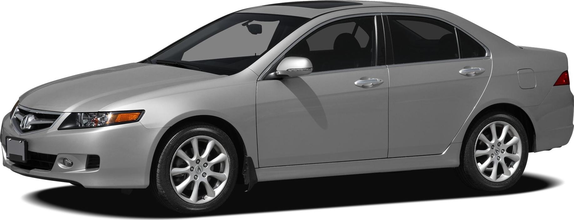 Side profile of a silver 4-door sedan with alloy wheels.