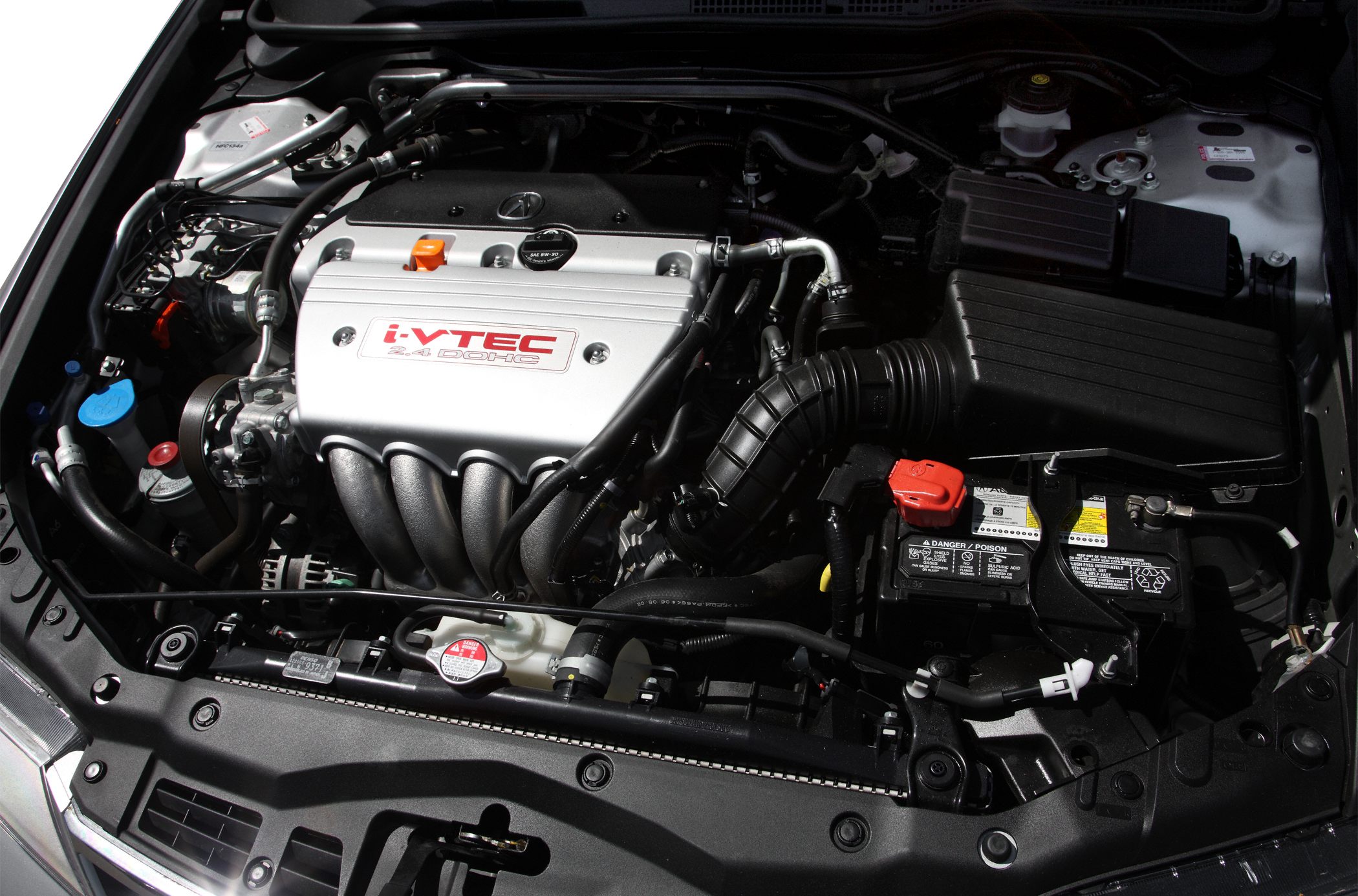 Clean i-VTEC 2.4L DOHC engine bay with organized components