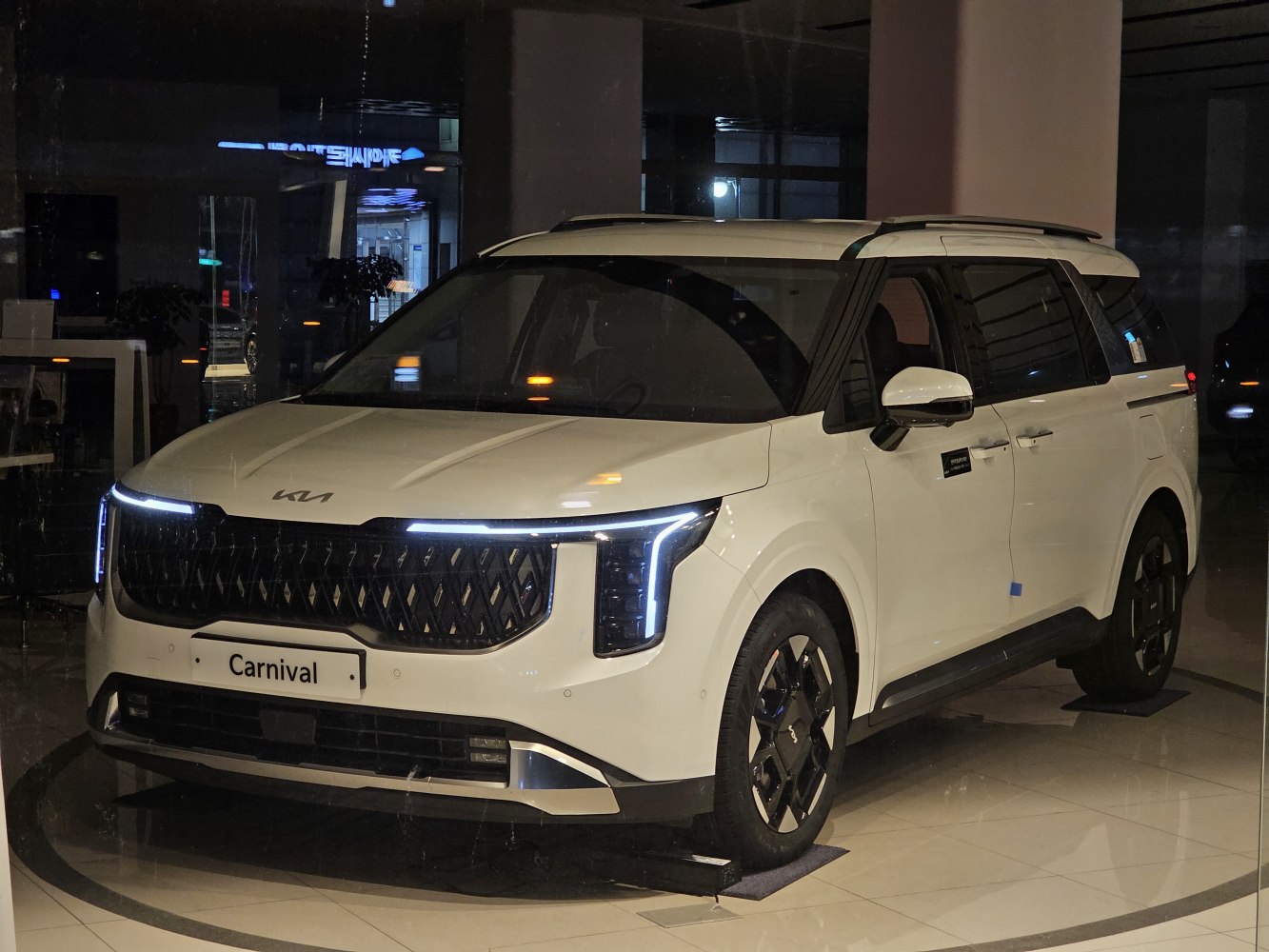 Modern minivan with bold grille and distinctive LED headlights