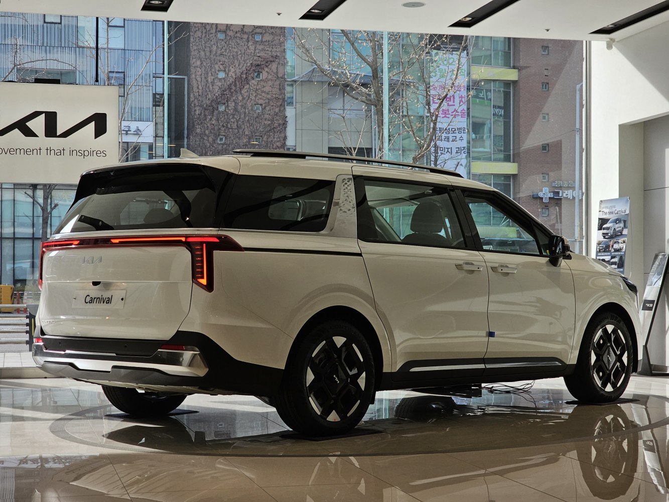Rear and side view of modern minivan with distinctive LED tail lights