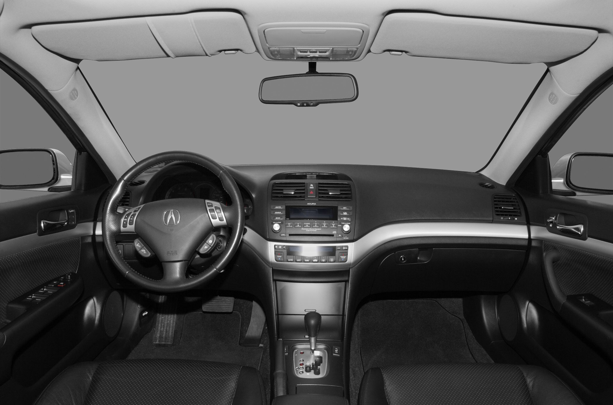 Steering wheel with controls and dashboard with center console