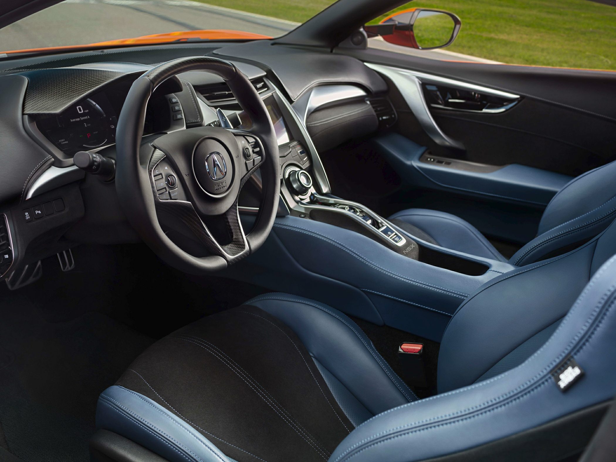 Modern sports car interior with blue leather seats and advanced cockpit design