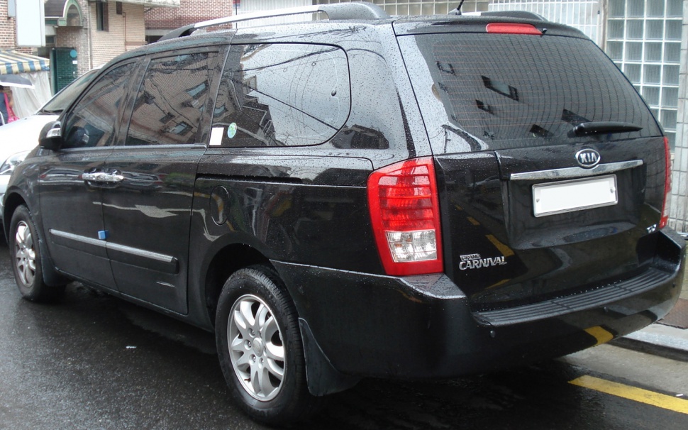Minivan rear and side view with large windows and rear taillights