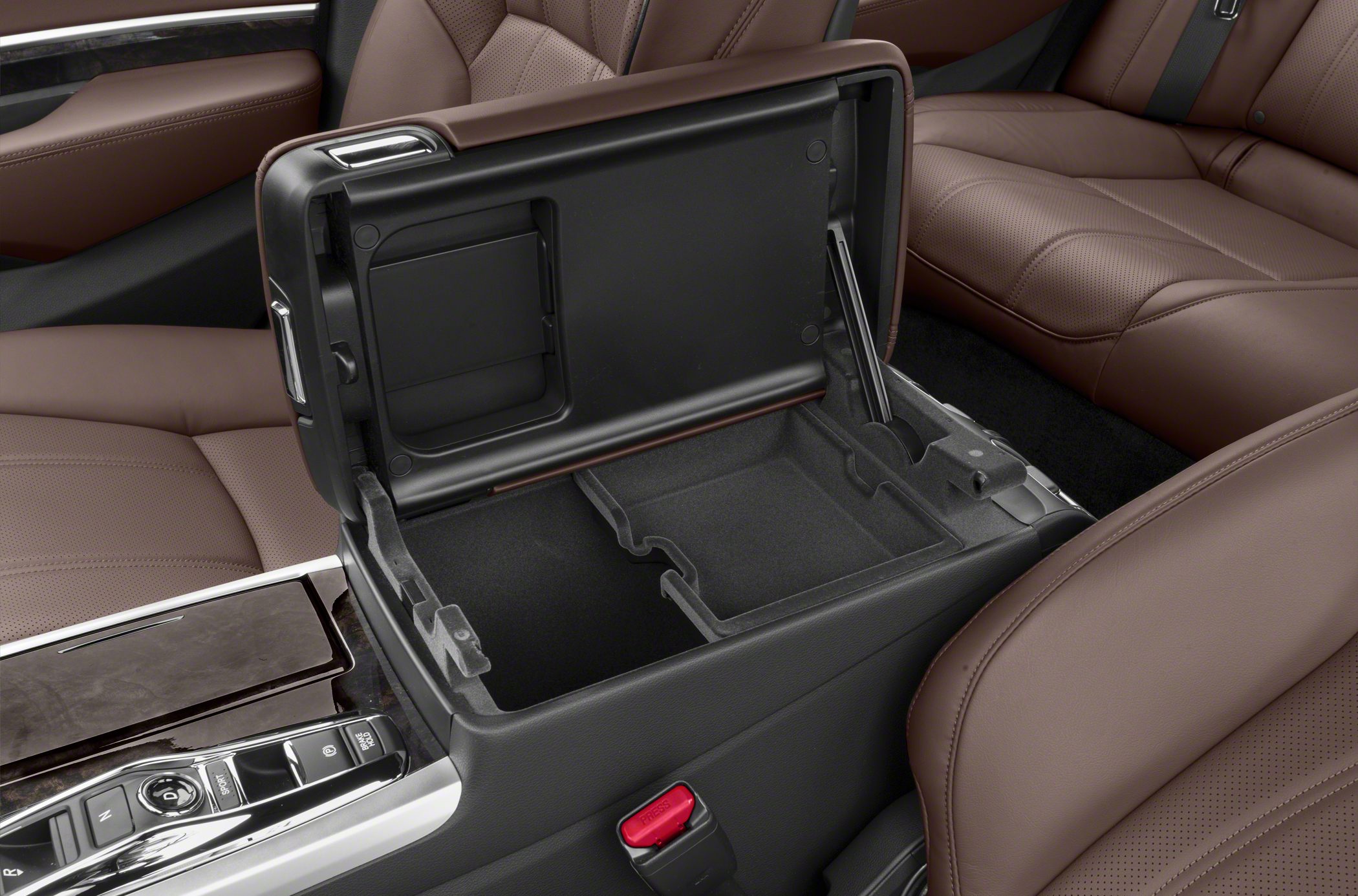 Open center console storage with brown leather seats