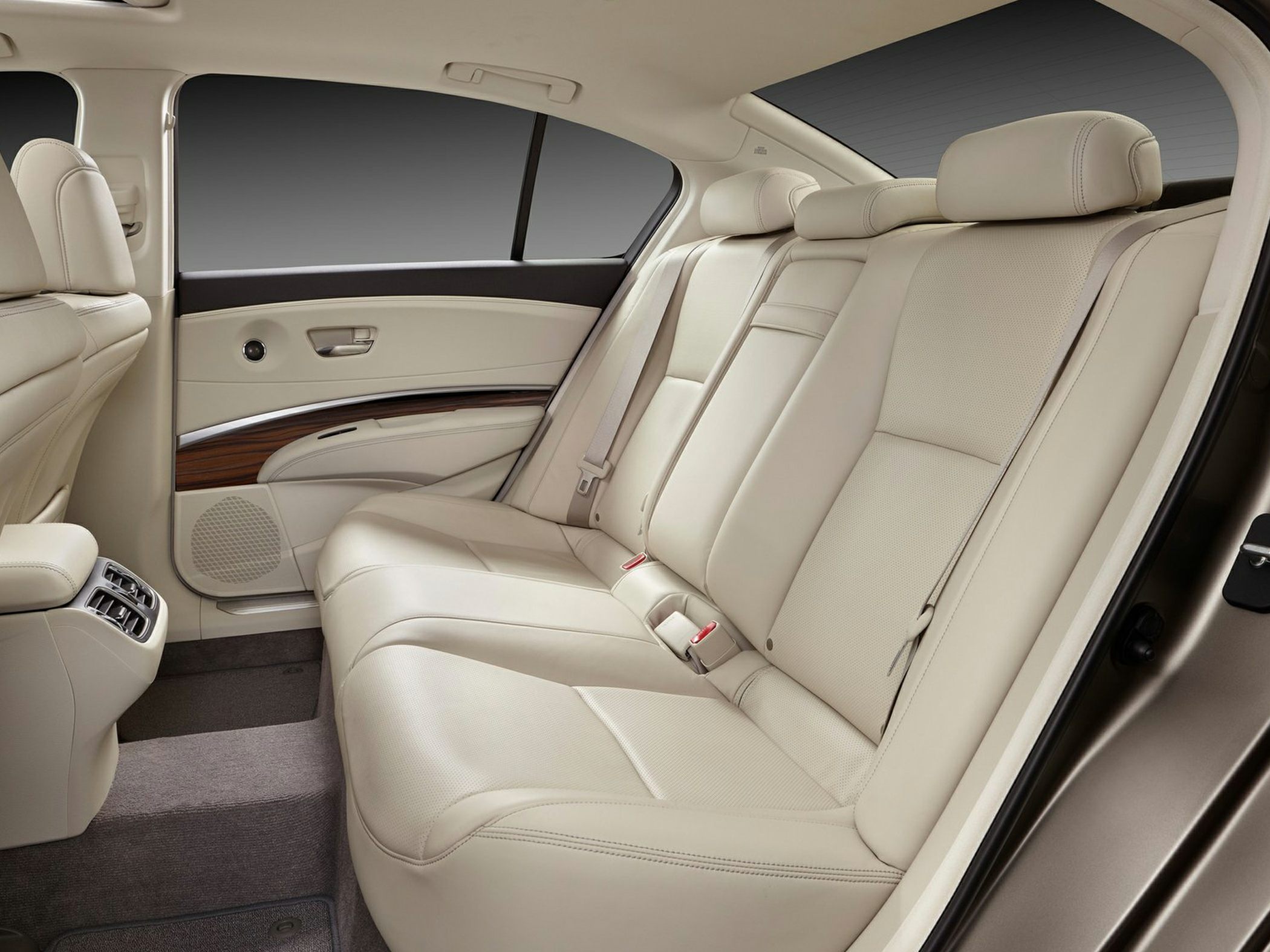 Beige leather rear seats with wood trim and rear air vents