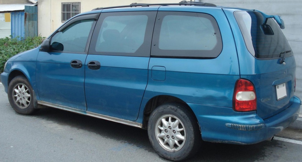 Minivan side profile with sliding doors and roof rails