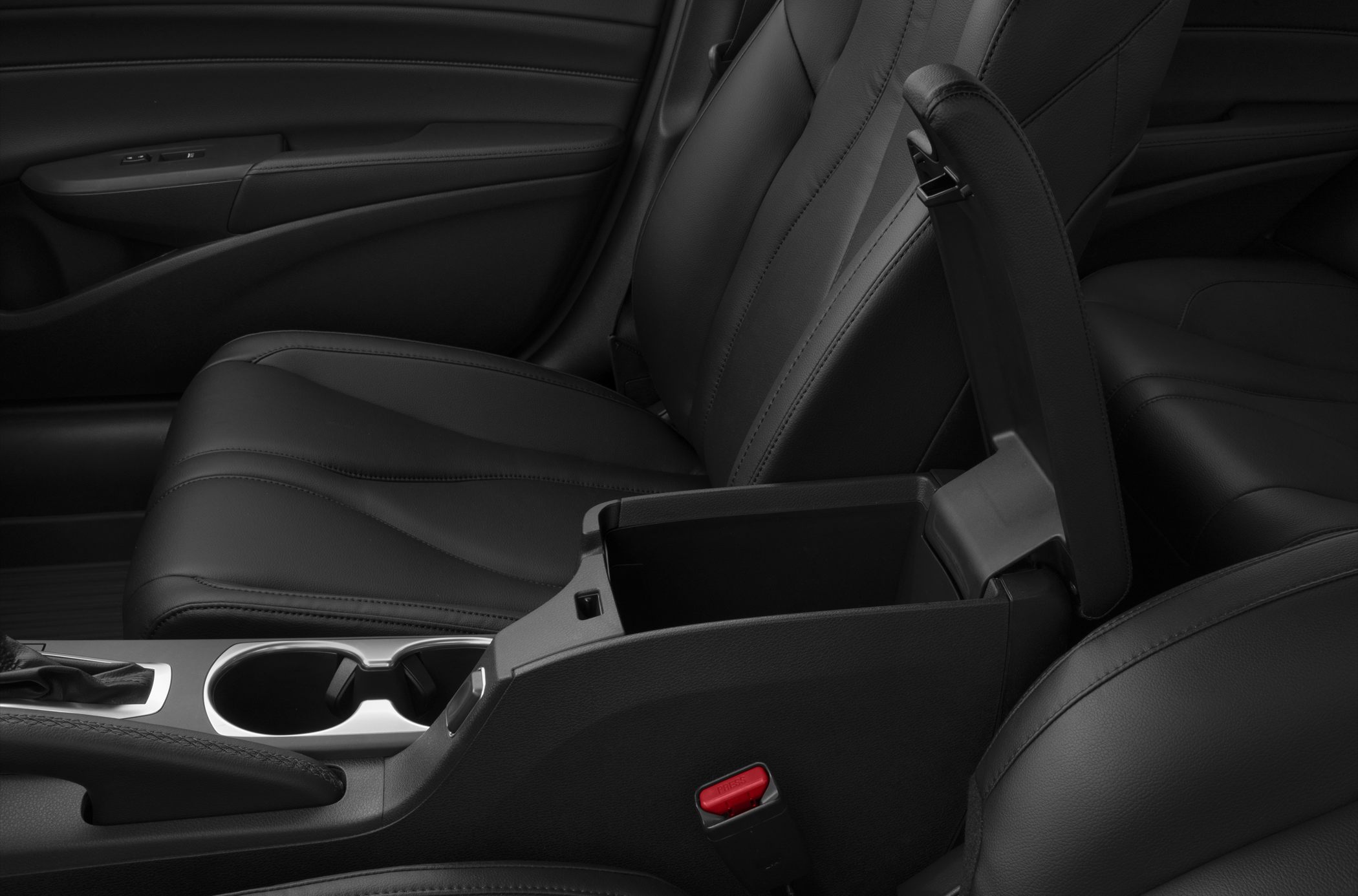Premium leather seats and open center console storage in car interior