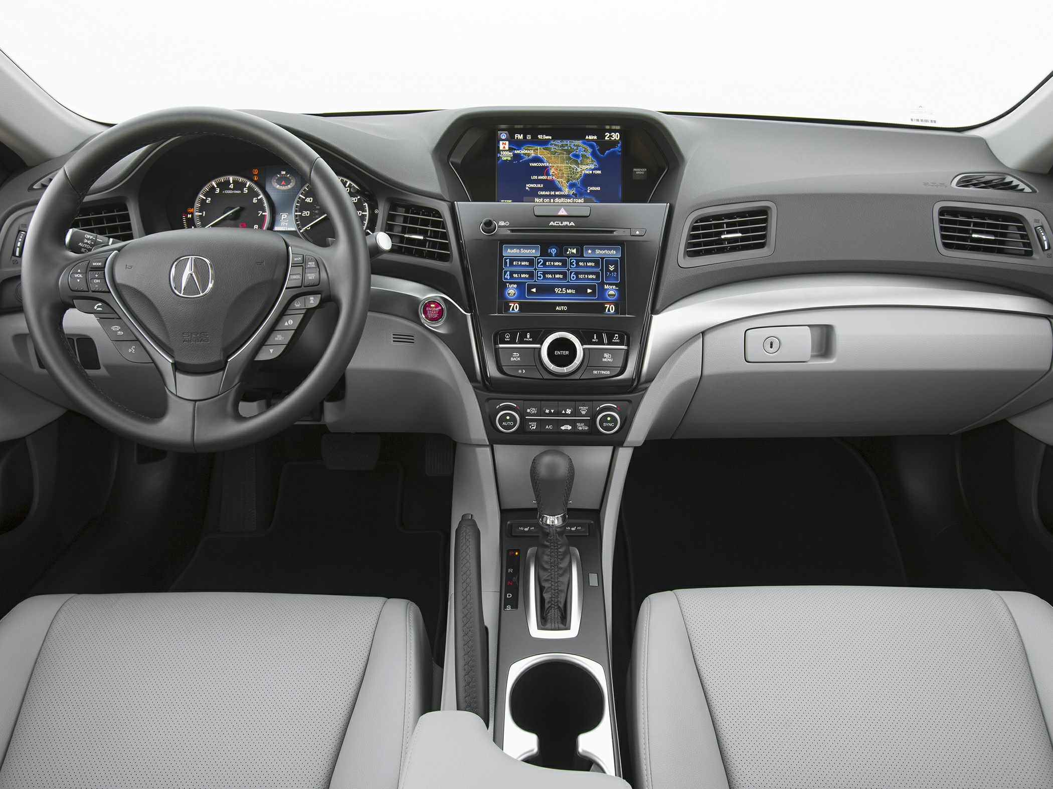Dashboard and infotainment system with steering wheel controls and automatic transmission.