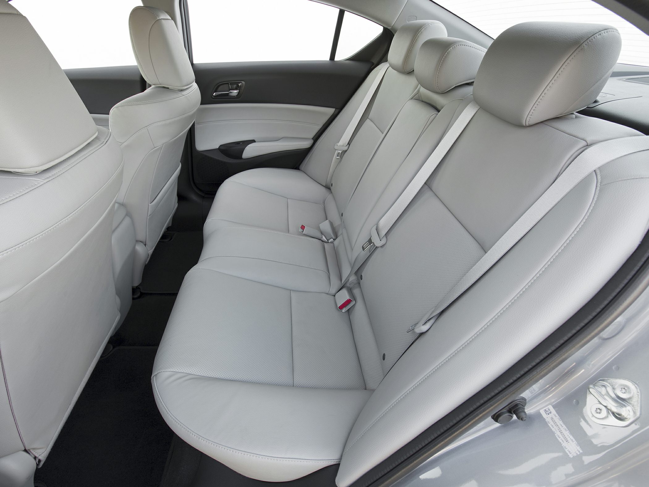 Rear leather seats with seat belts in a sedan