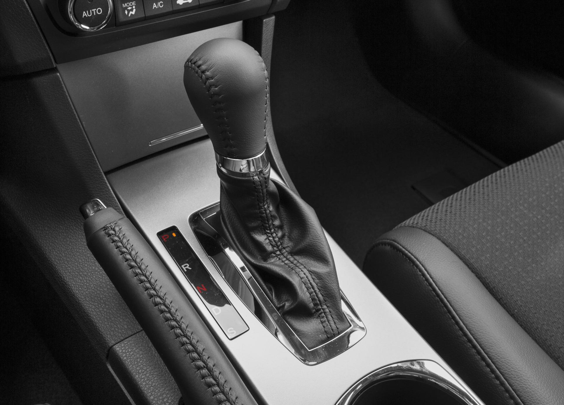 Automatic gear shift and stitched leather handbrake lever