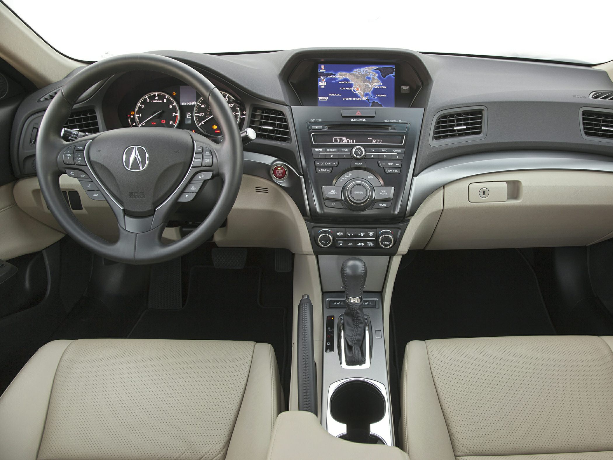 Steering wheel, dashboard controls, and multimedia display in light beige interior