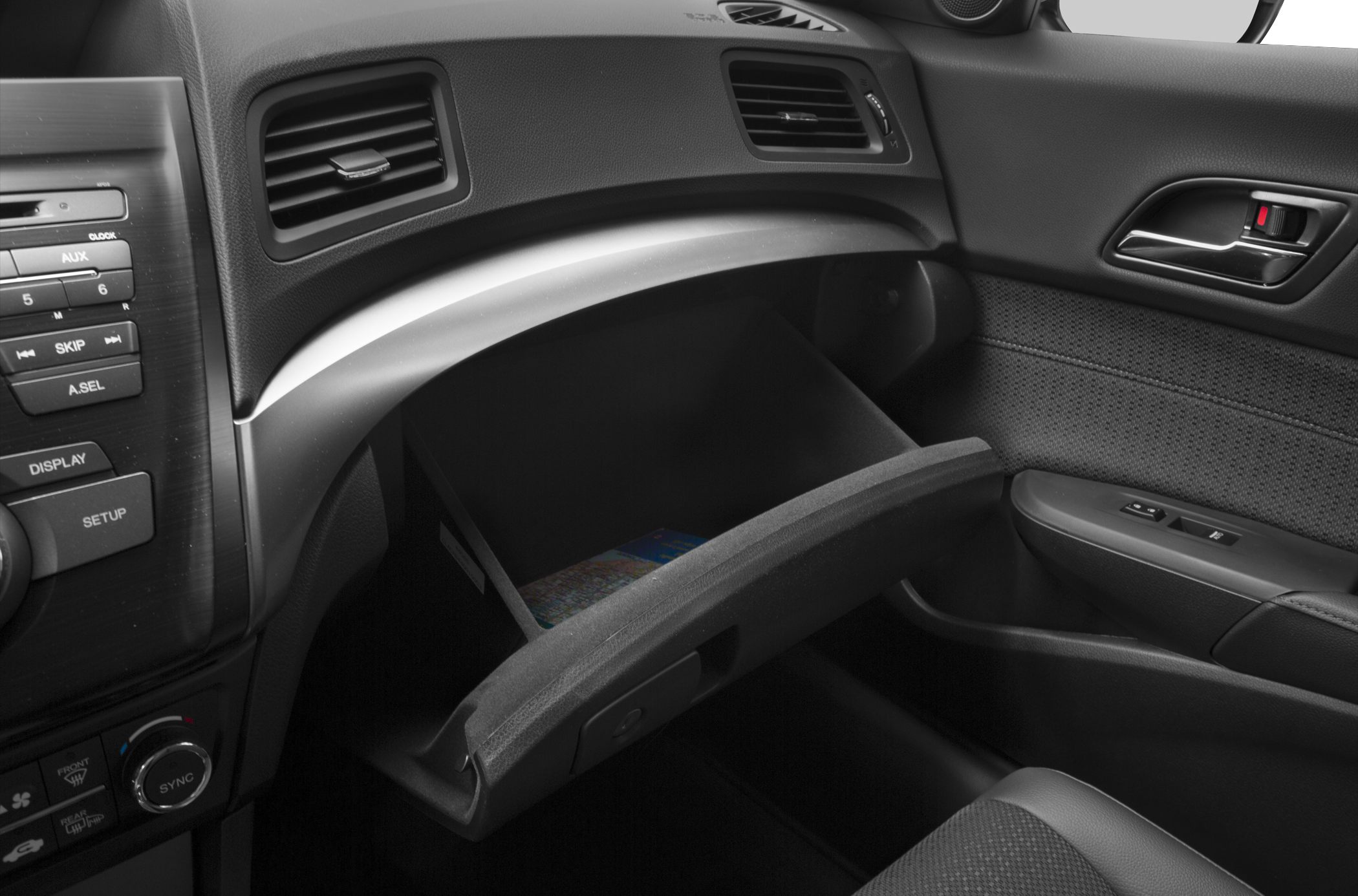 Open glove compartment with dashboard vents and control panel