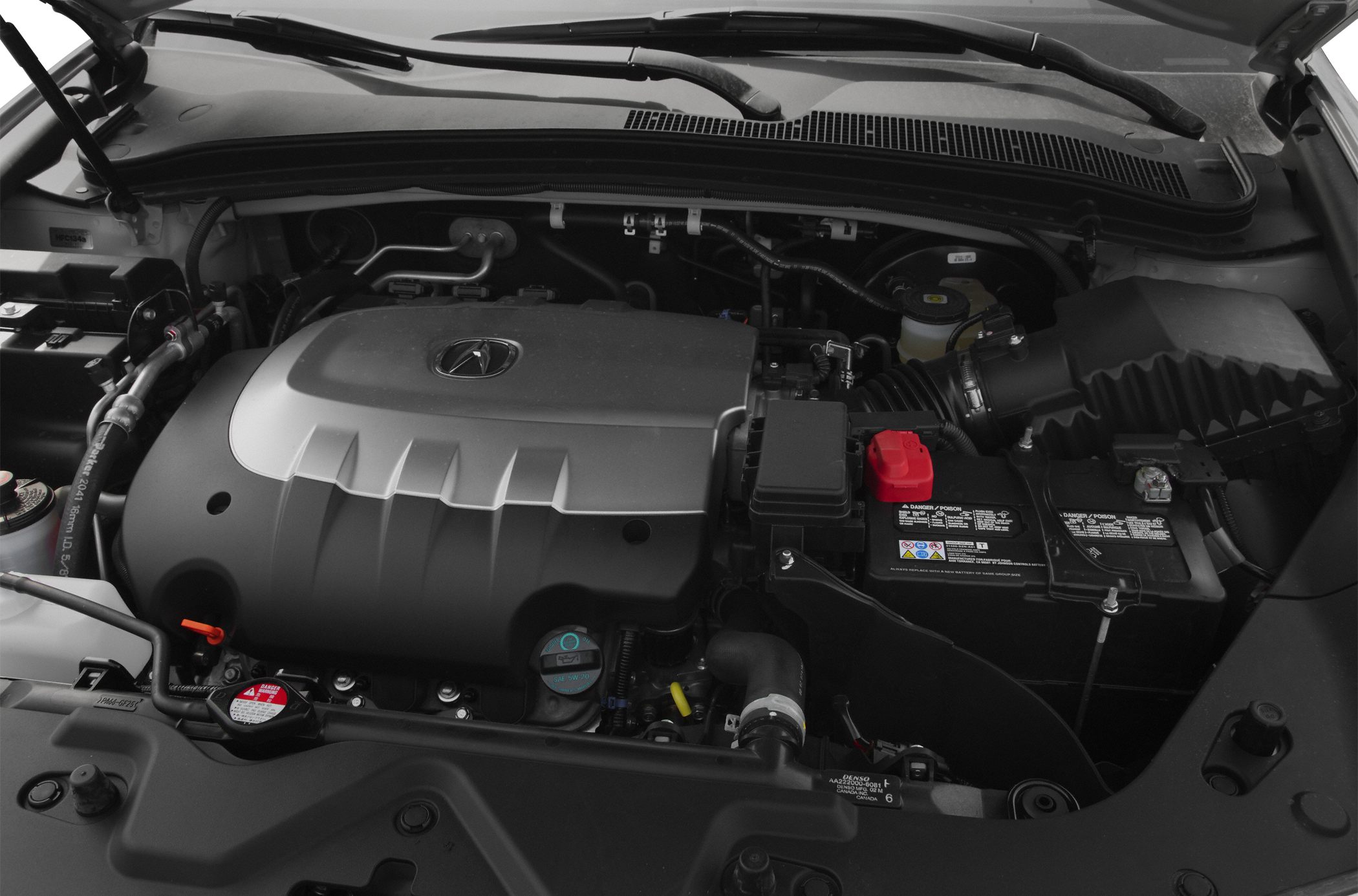 Engine bay with engine cover, battery, and air intake system