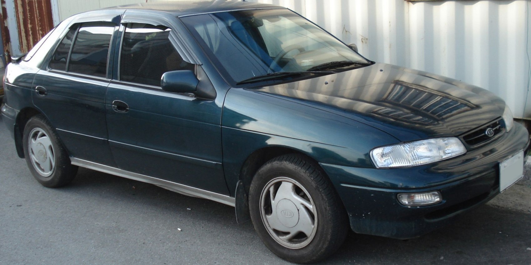 Front side view of 1993 compact hatchback with signature headlights