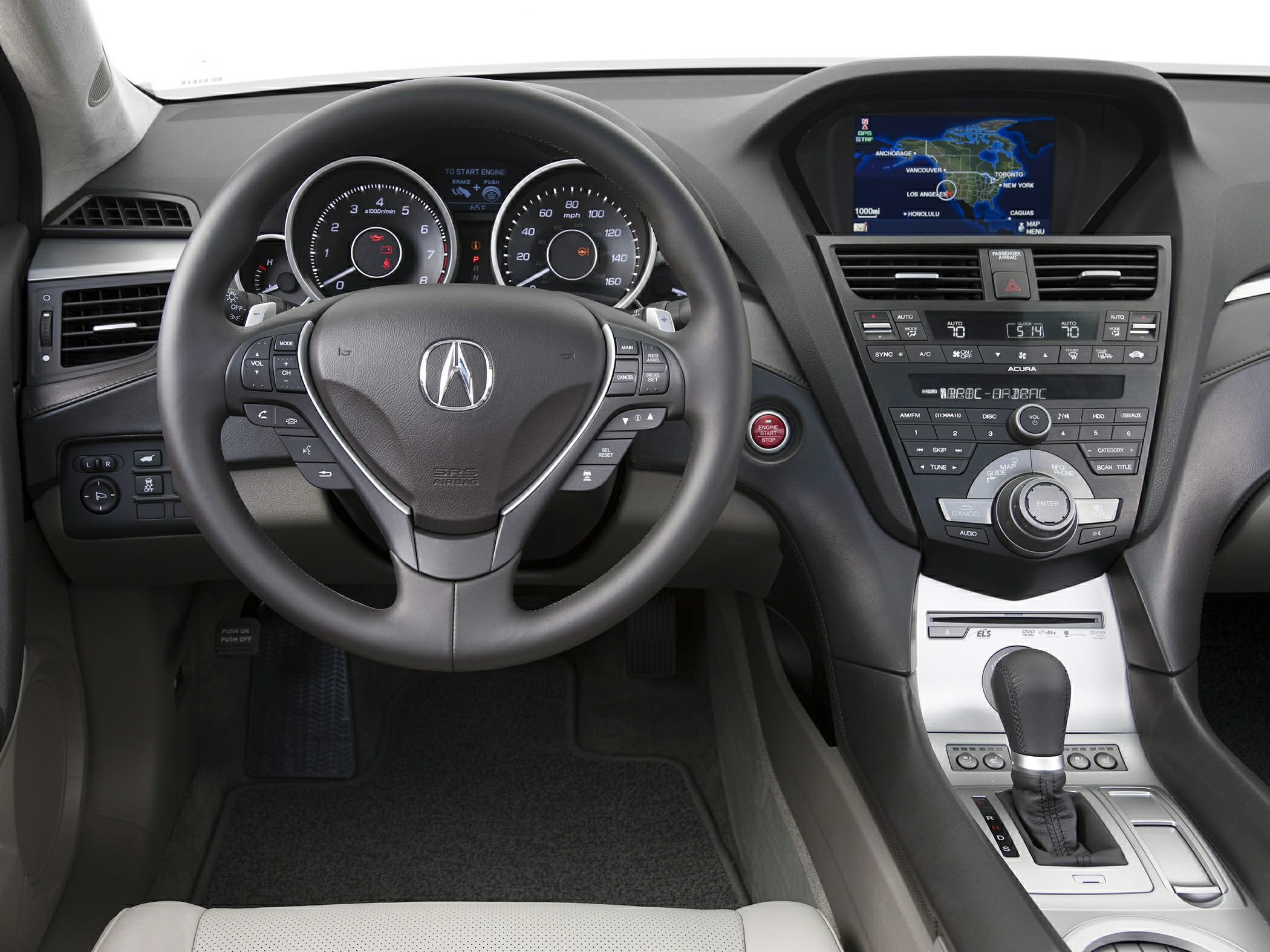 Steering wheel with controls and dashboard featuring navigation screen