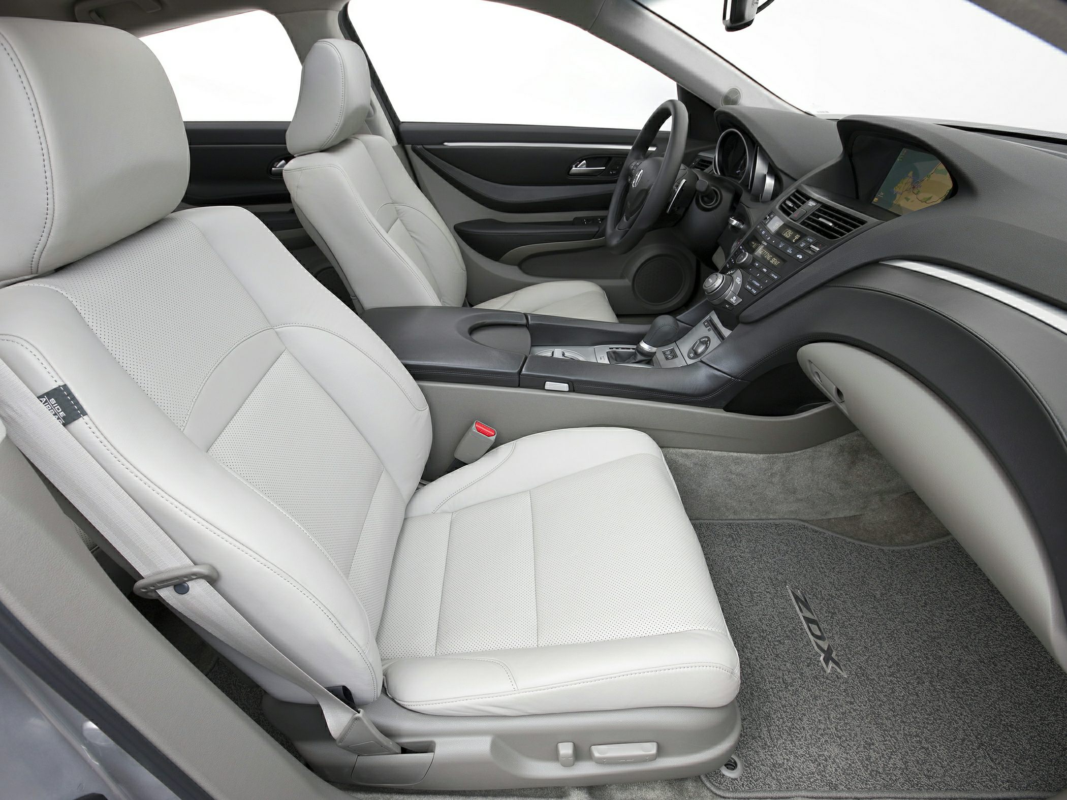 Light leather seats and modern dashboard with digital navigation display