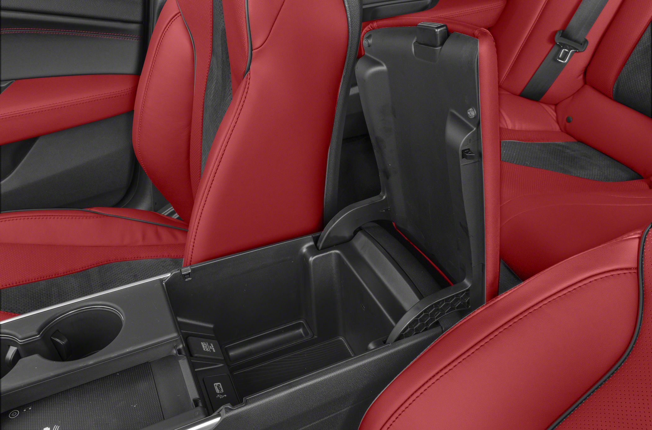Open center console storage with red leather upholstery
