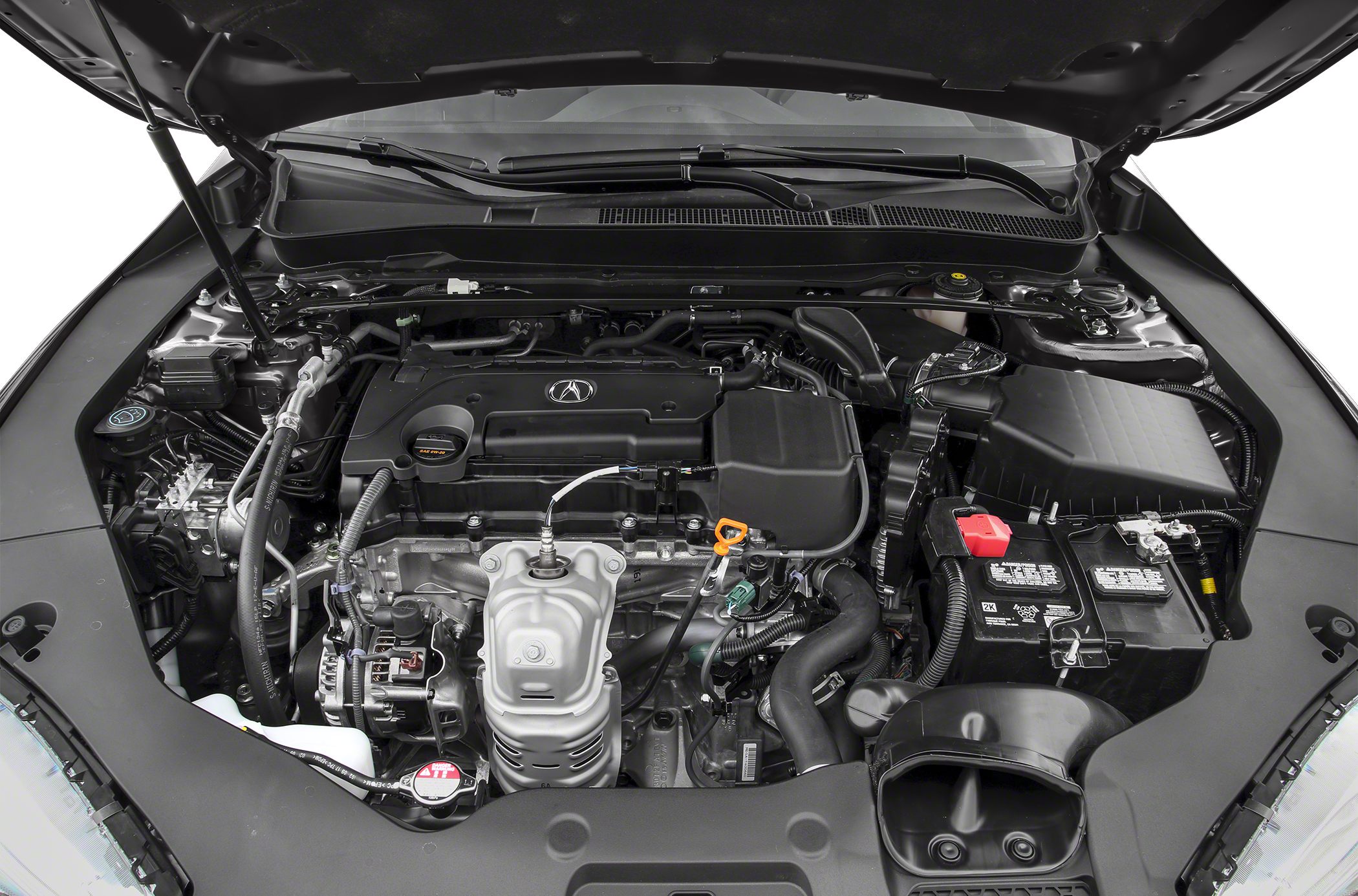Open engine bay with visible engine components and battery