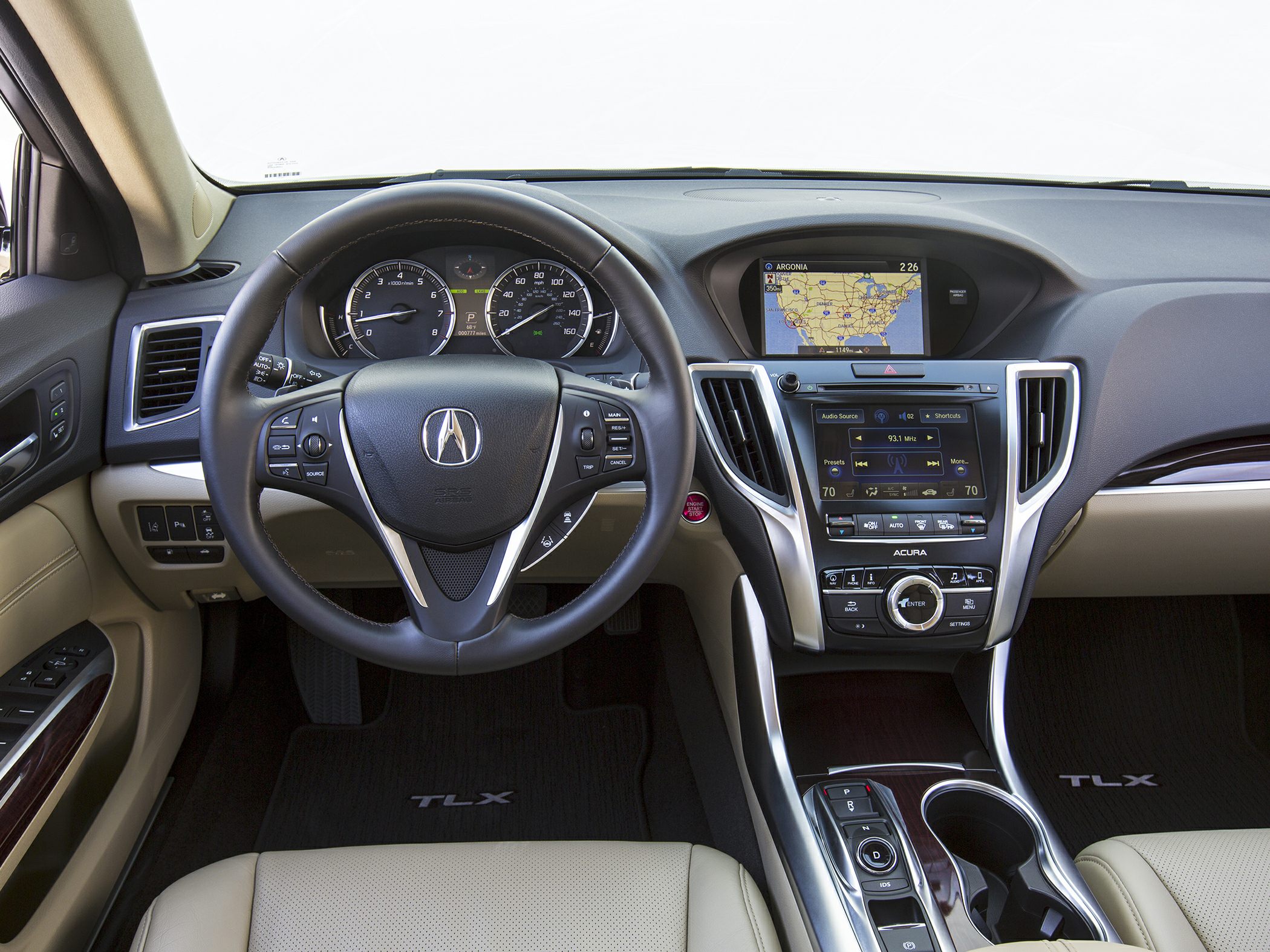 Dashboard, steering wheel with controls, navigation screen, and center console features