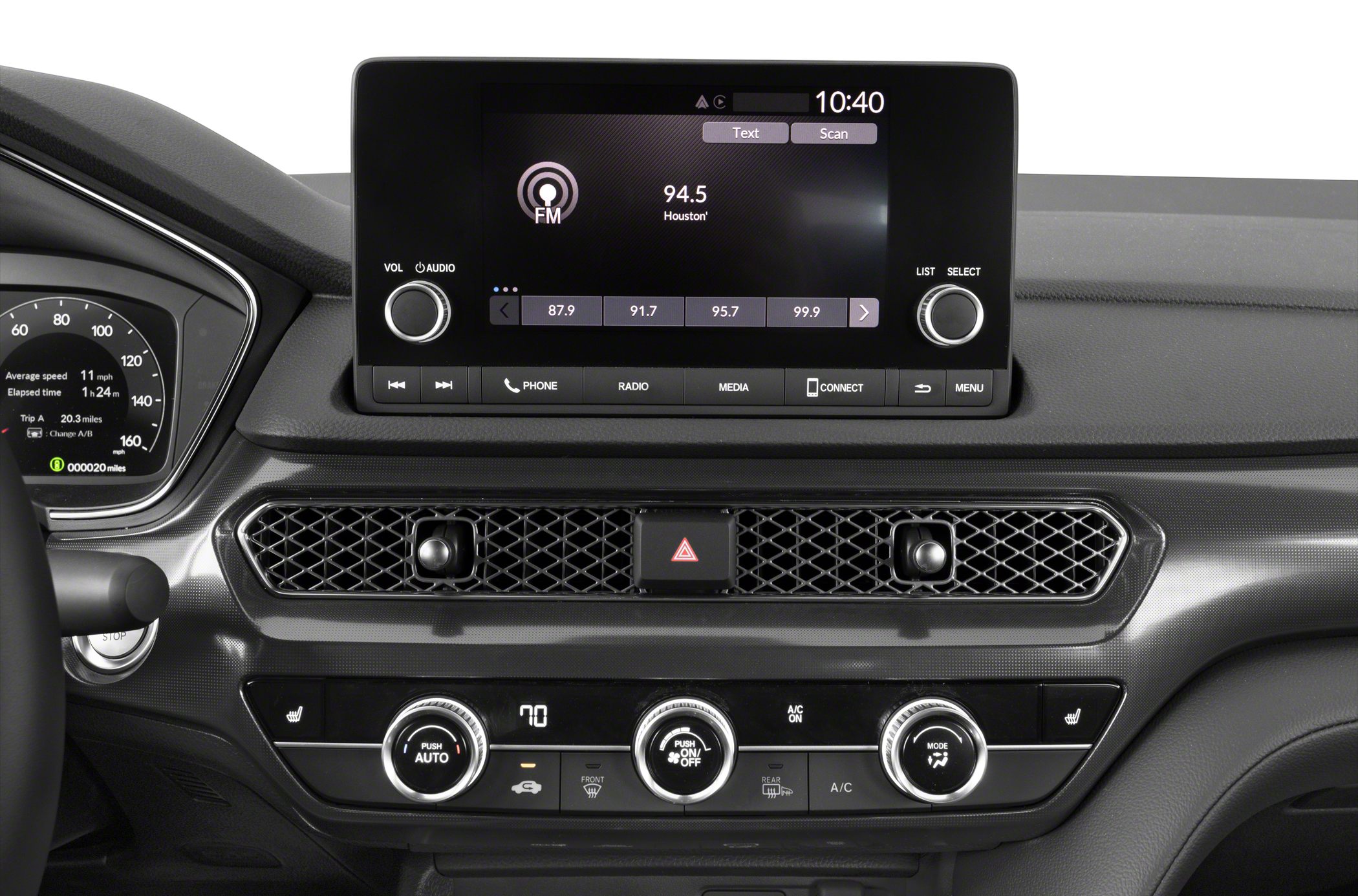 Digital infotainment screen and climate control panel with knobs and buttons.