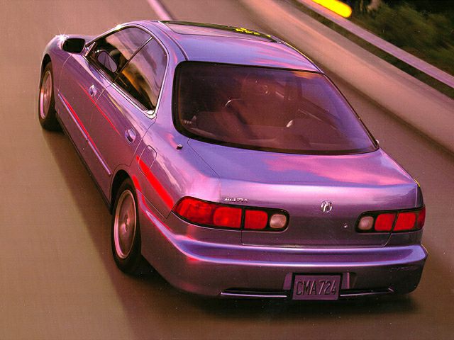 Rear view with taillights and rear spoiler on a sedan