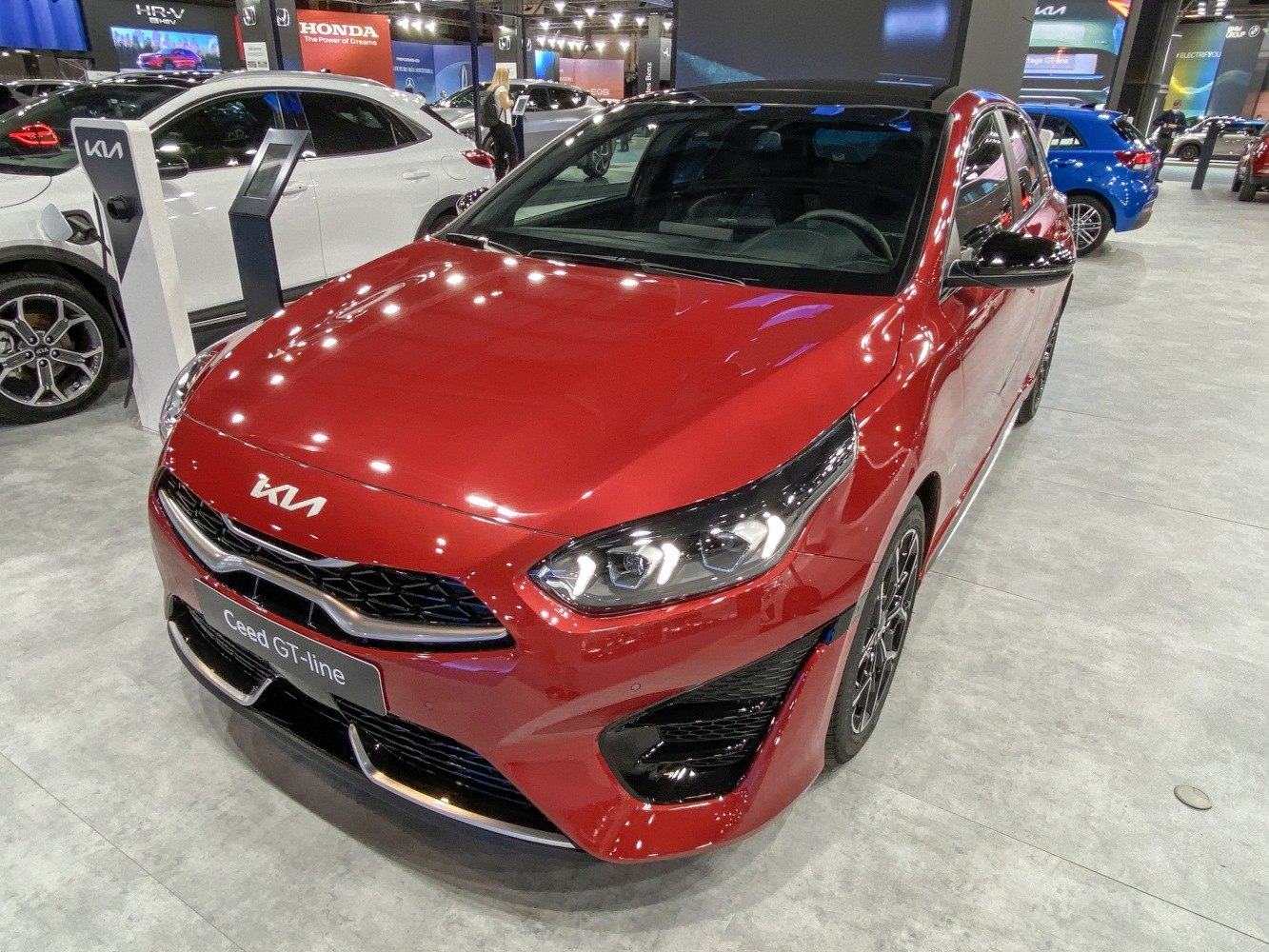 Front view of sporty hatchback featuring LED headlights and grille